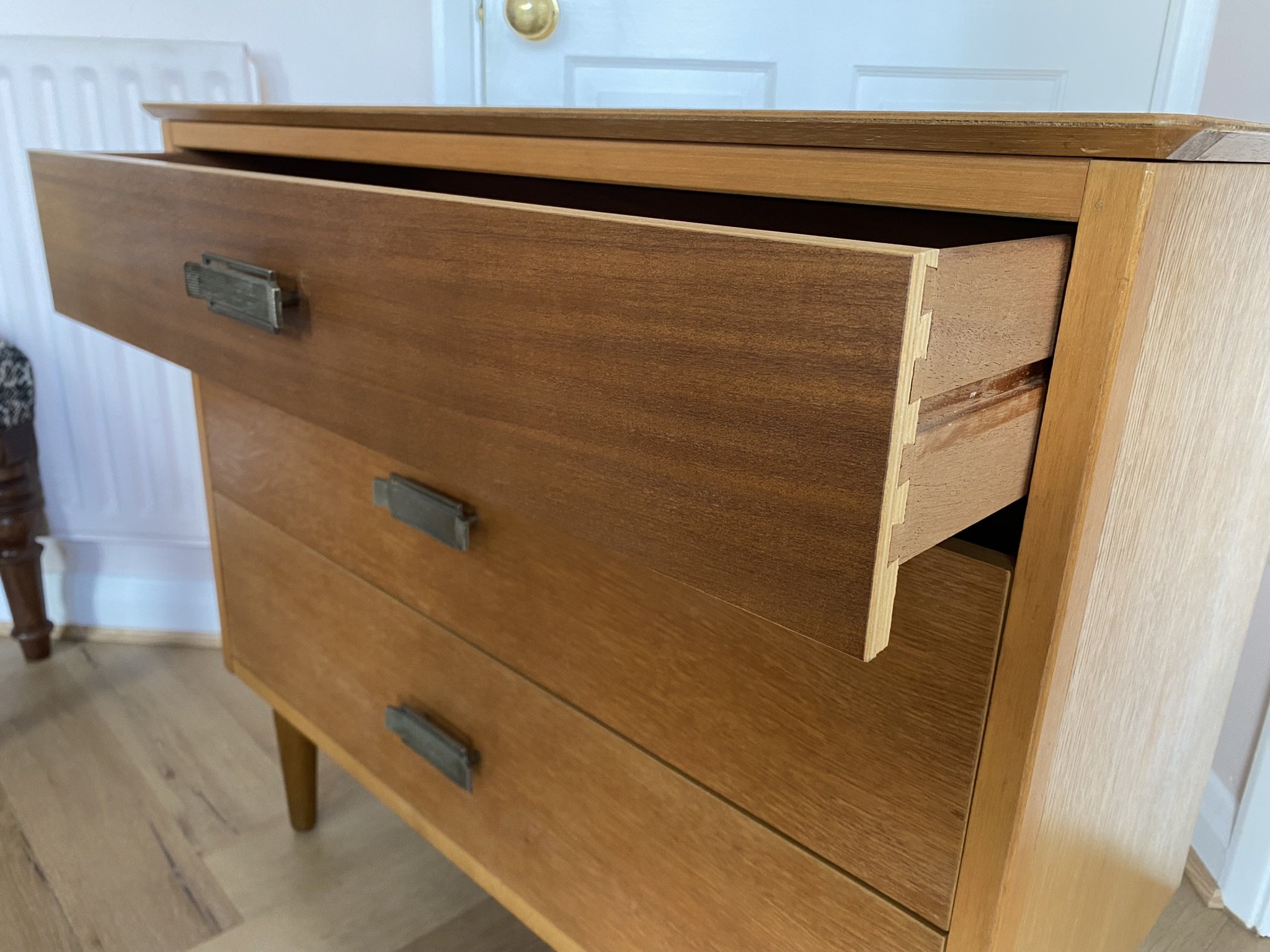 Mid century teak chest of three drawers with metal handles