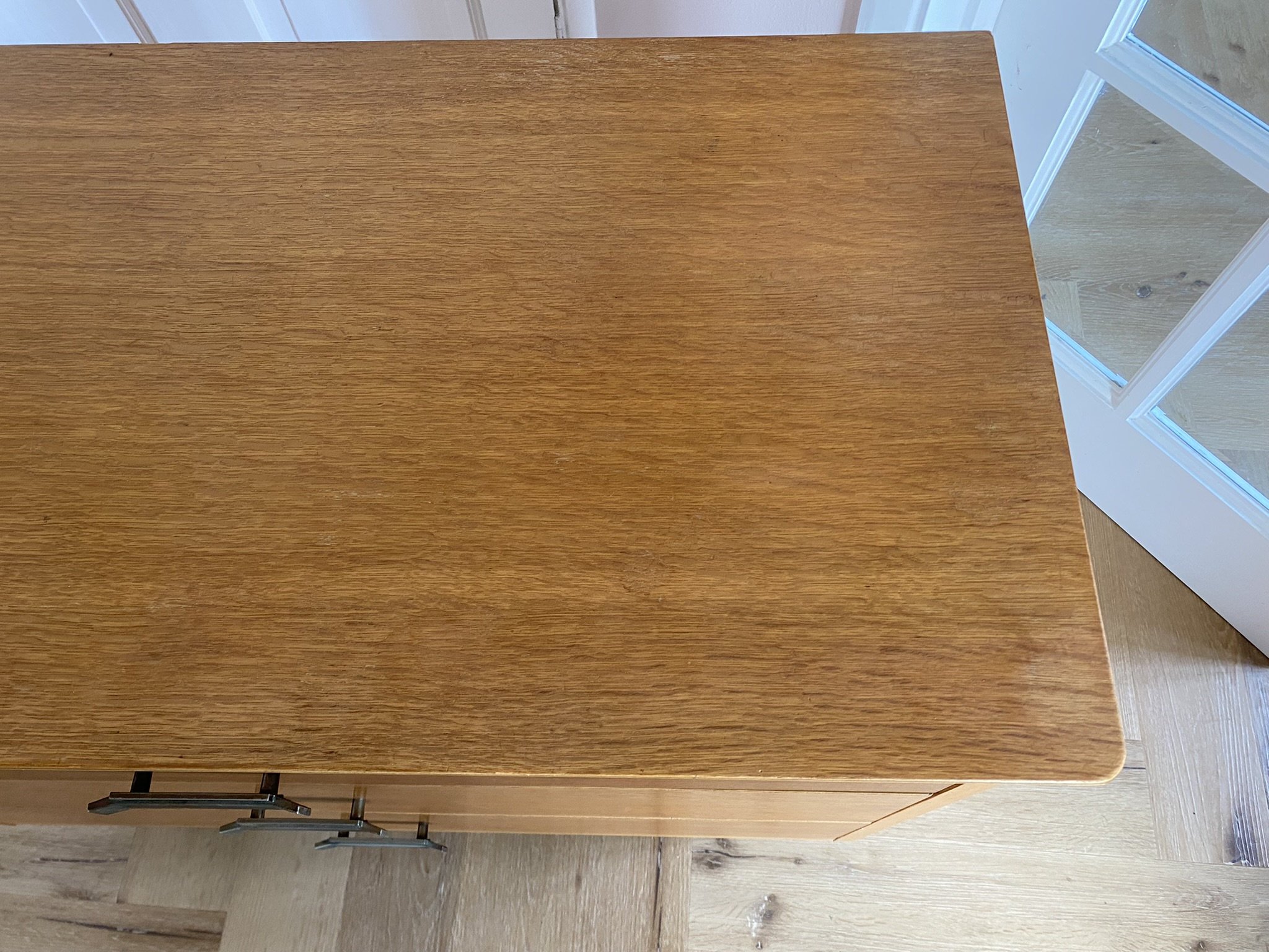 Mid century teak chest of three drawers with metal handles