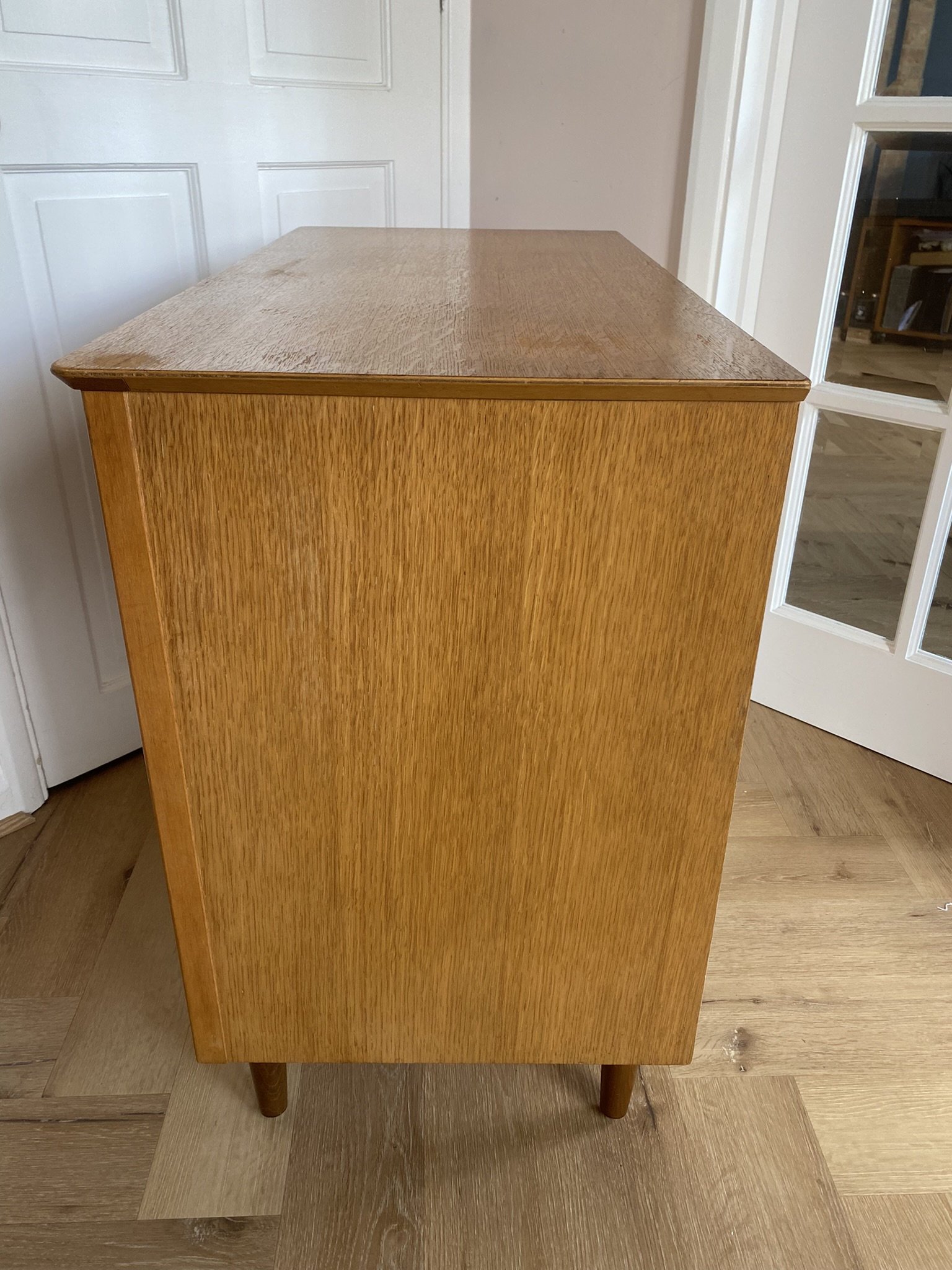 Mid century teak chest of three drawers with metal handles