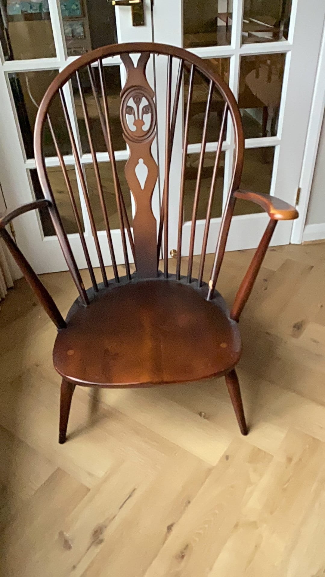 Vintage Ercol 1970s fleur de lis back armchair