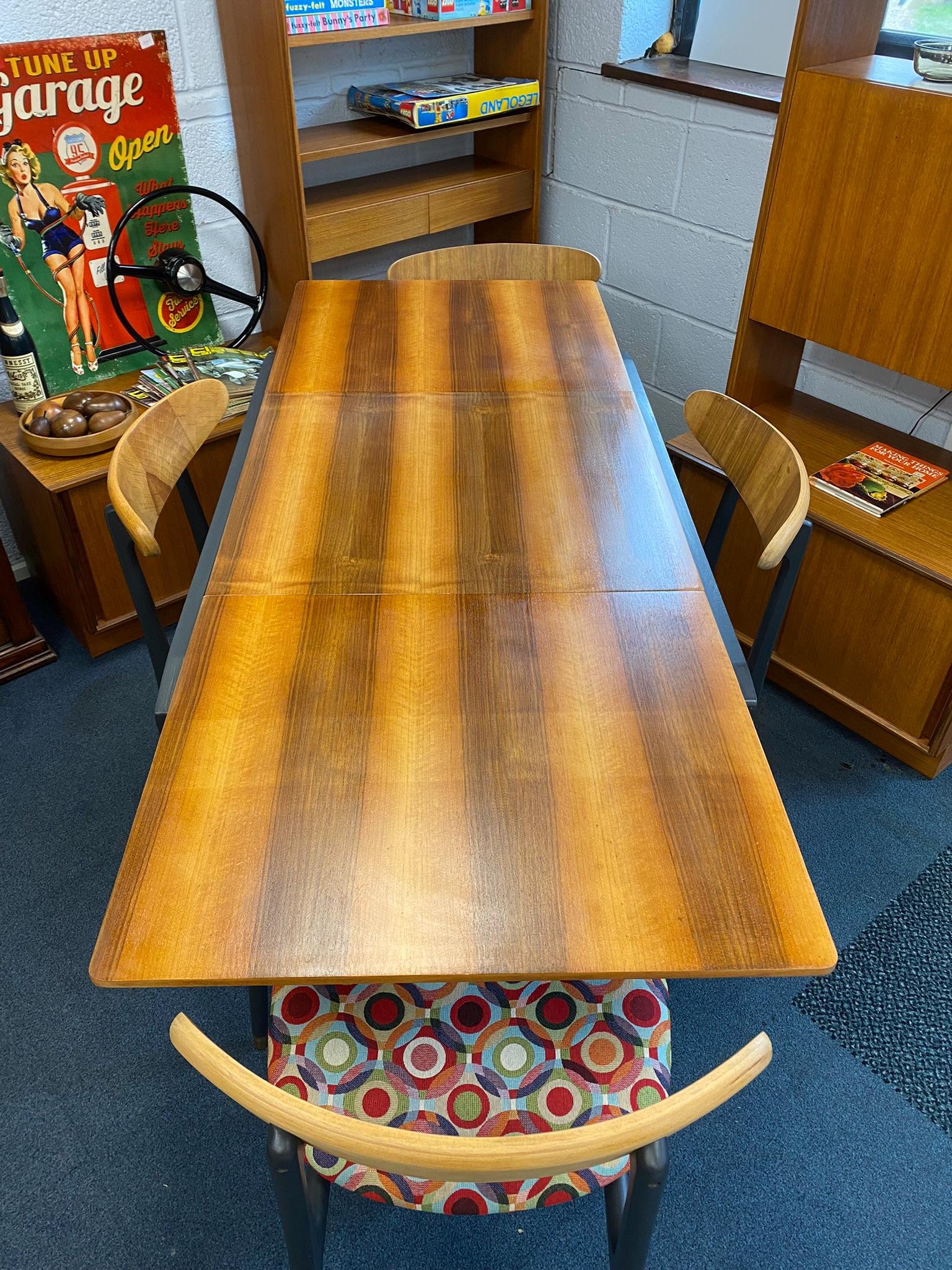 Restored and restyled mid century Danish style teak extending table and four butterfly style chairs
