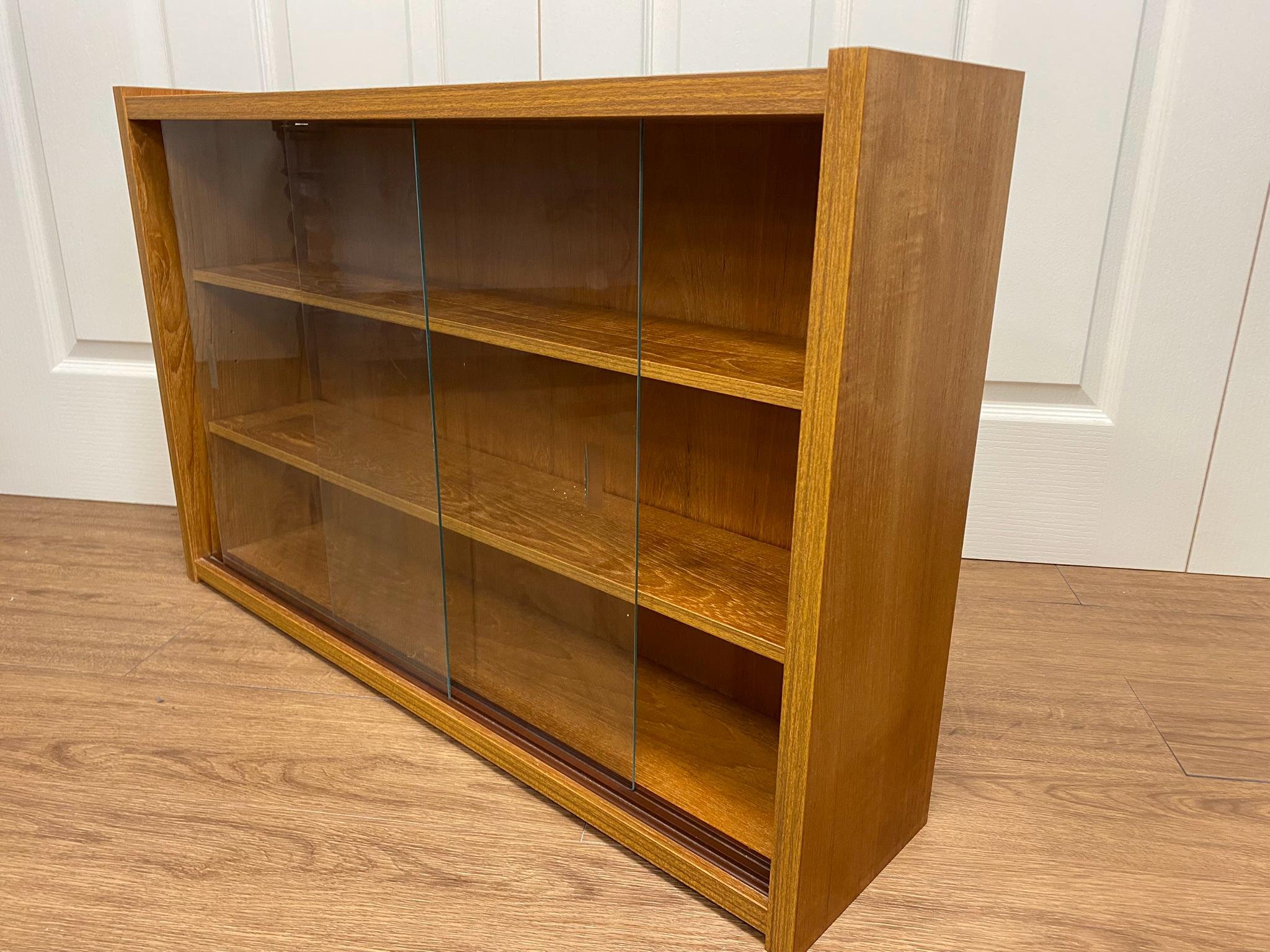 1960s mid century teak PS System, Danish Furniture glass sliding door floating wall cabinet design number 3309
