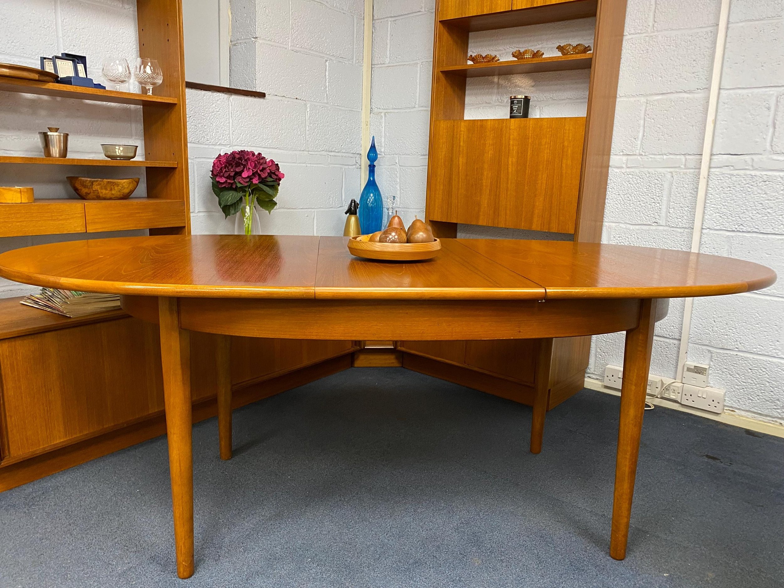 Mid century 1960s Danish style solid teak extending oval dining table