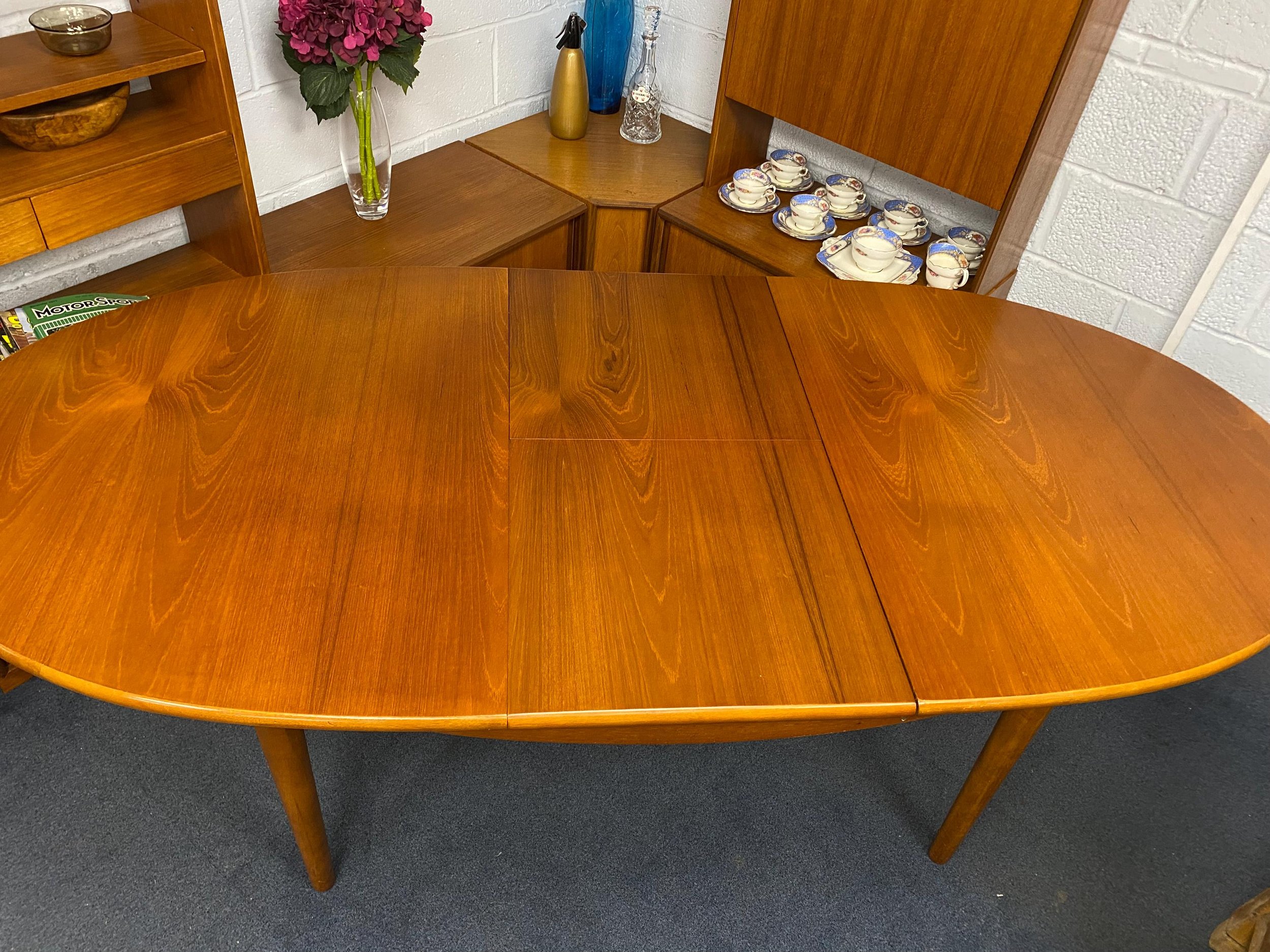 Mid century 1960s Danish style solid teak extending oval dining table