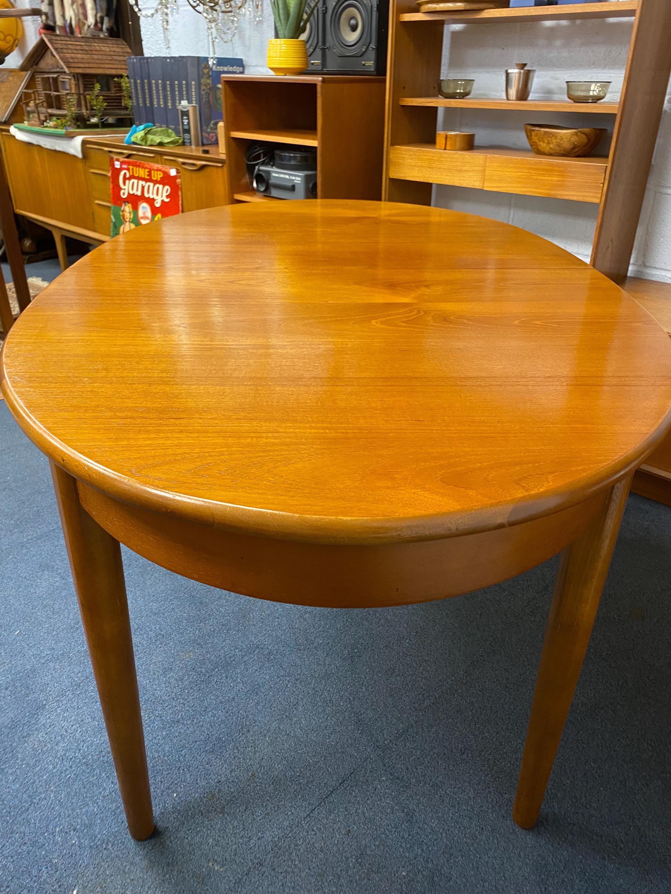 Mid century 1960s Danish style solid teak extending oval dining table