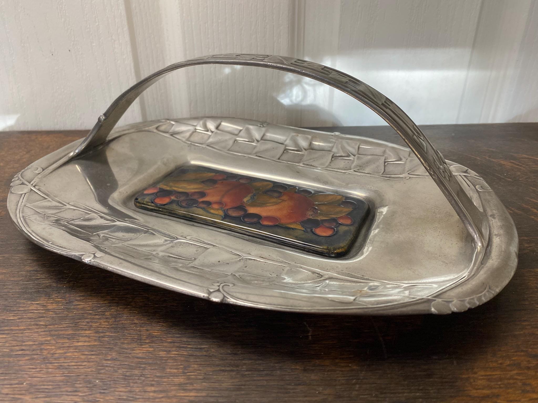 Antique pewter cake tray from the Tudric range by Liberty and Co