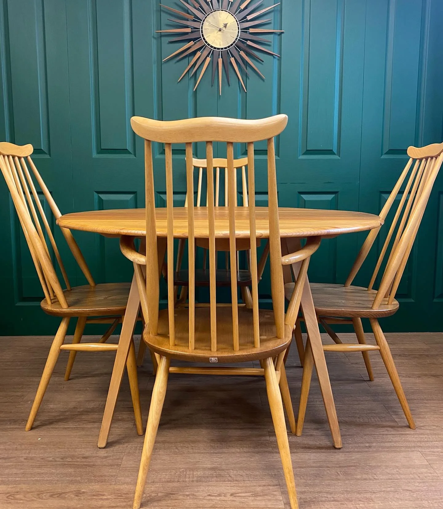 New in, this fully restored mid-century Ercol folding dining table with four original Ercol chairs, including two carvers. Model 383.

Crafted from solid elm and beech, this classic Ercol set showcases the brand&rsquo;s hallmark combination of qualit