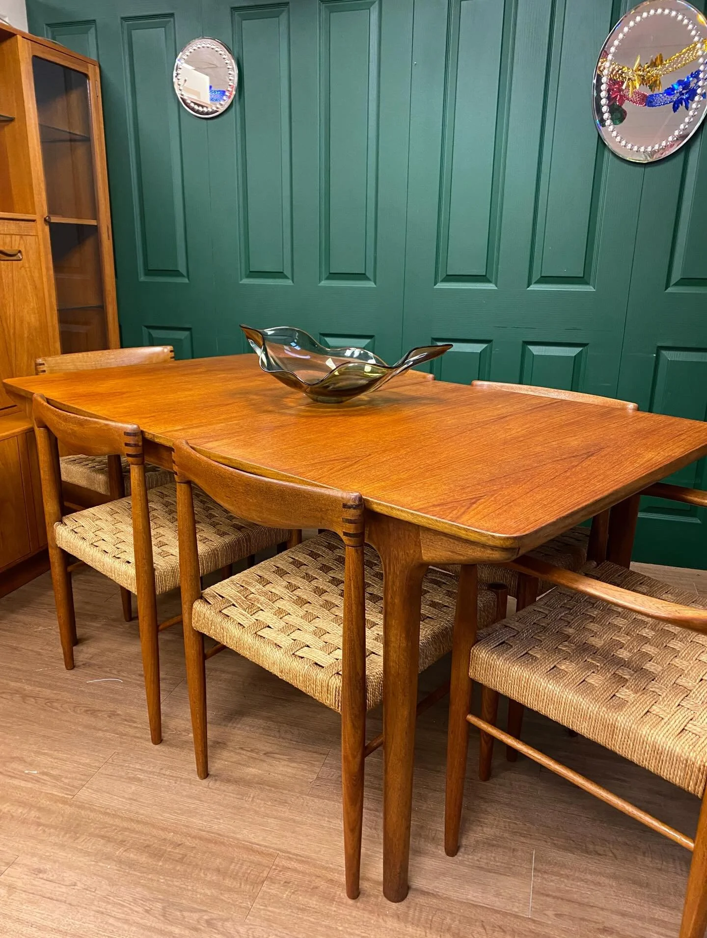 Restored and ready for a new home!

This massive mid-century dining set comprising a McIntosh teak extending refractory table paired with six solid teak and rattan chairs by designer H.W. Klein for Bramin, including two carvers.

Perfect for a big fa