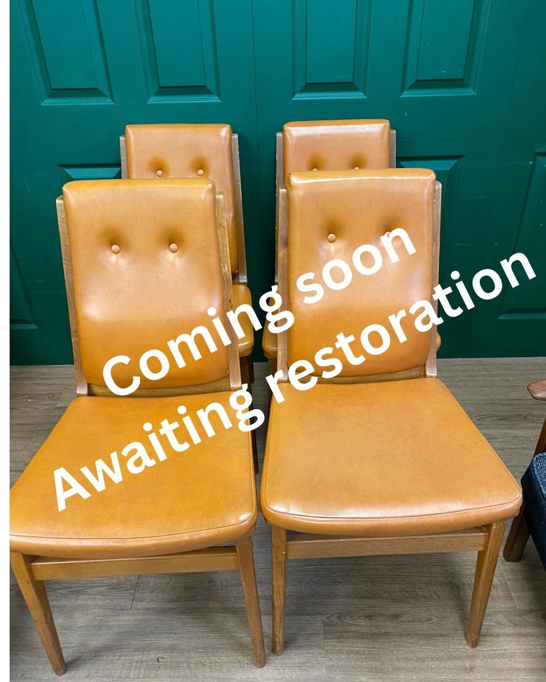 Set of four mid century 1970s teak and orange vinyl high button back dining chairs