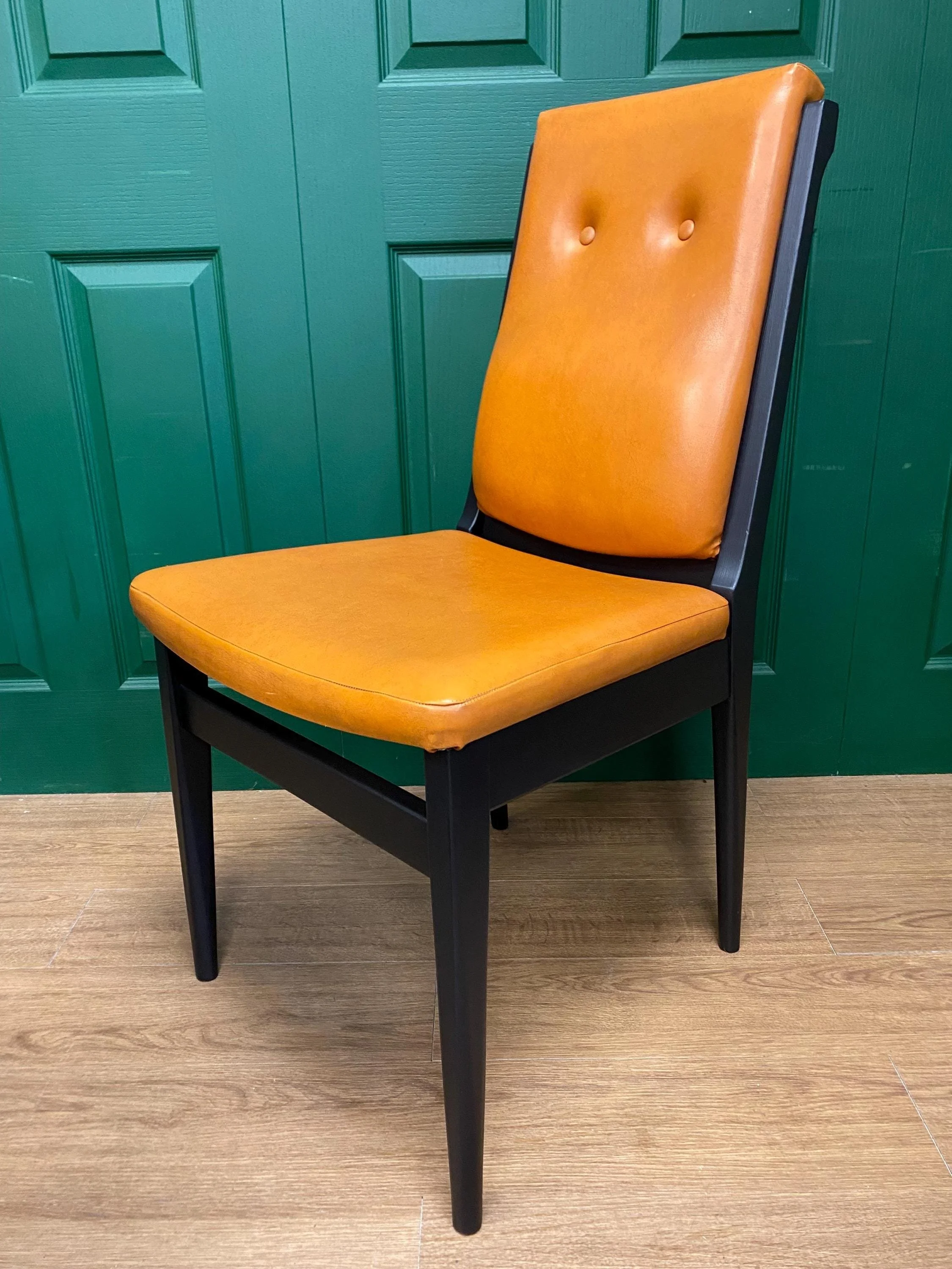 Set of four vintage mid century 1970s black  and orange vinyl high button back dining chairs