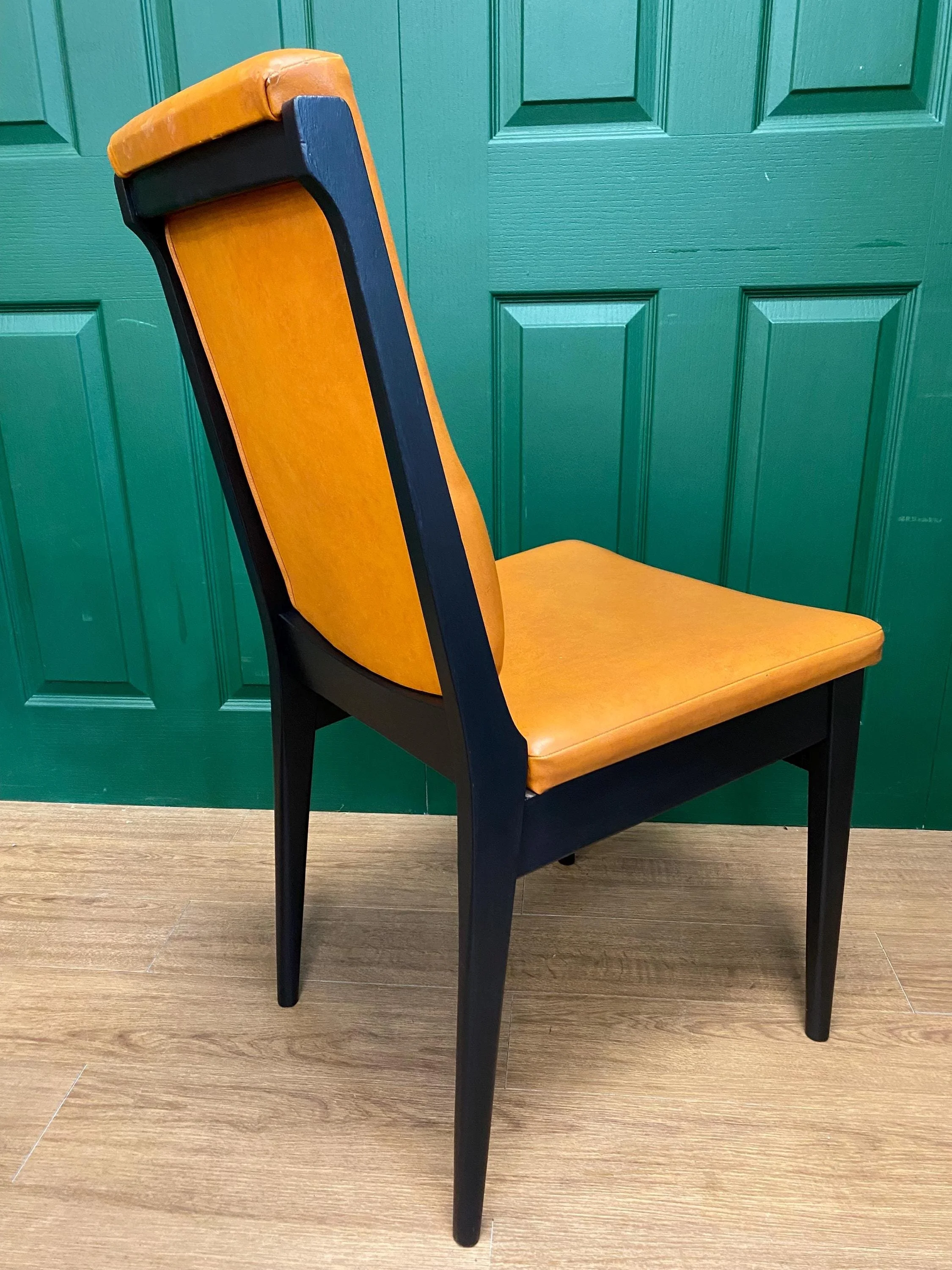 Set of four vintage mid century 1970s black  and orange vinyl high button back dining chairs