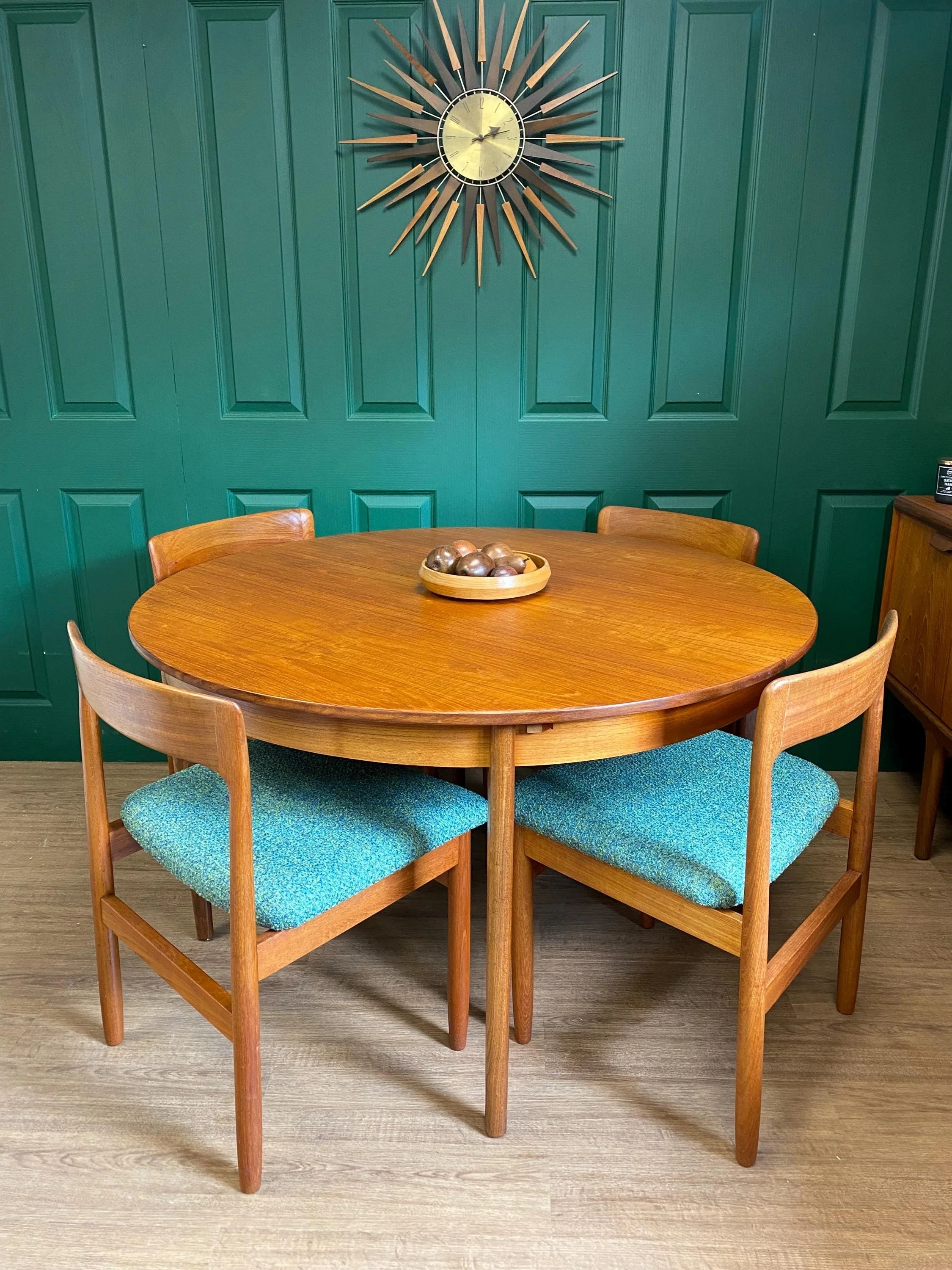 Restored and reupholstered 1960s John Herbert for Younger teak extending circular dining table and four chairs blue