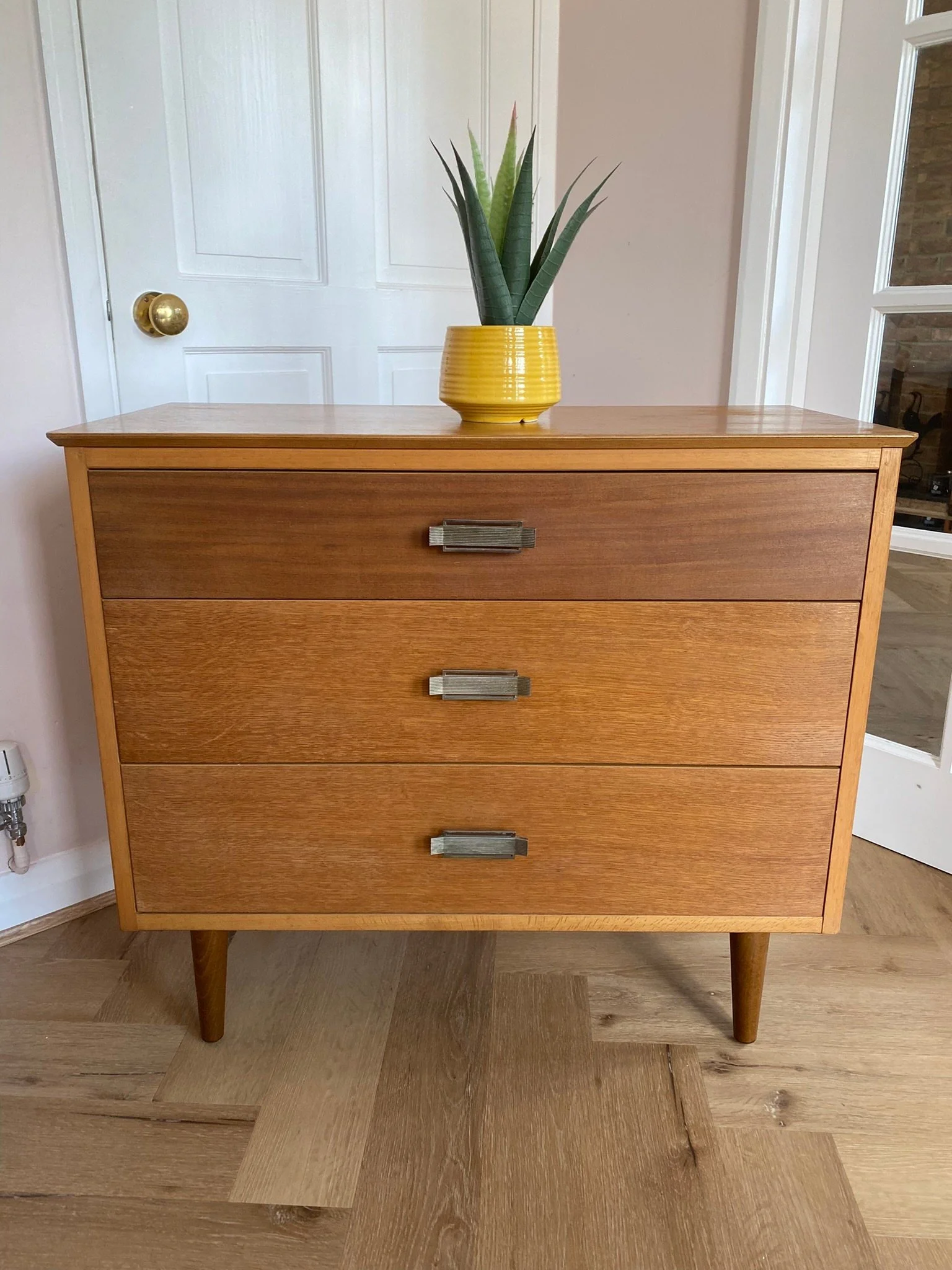 Mid century teak chest of three drawers with metal handles