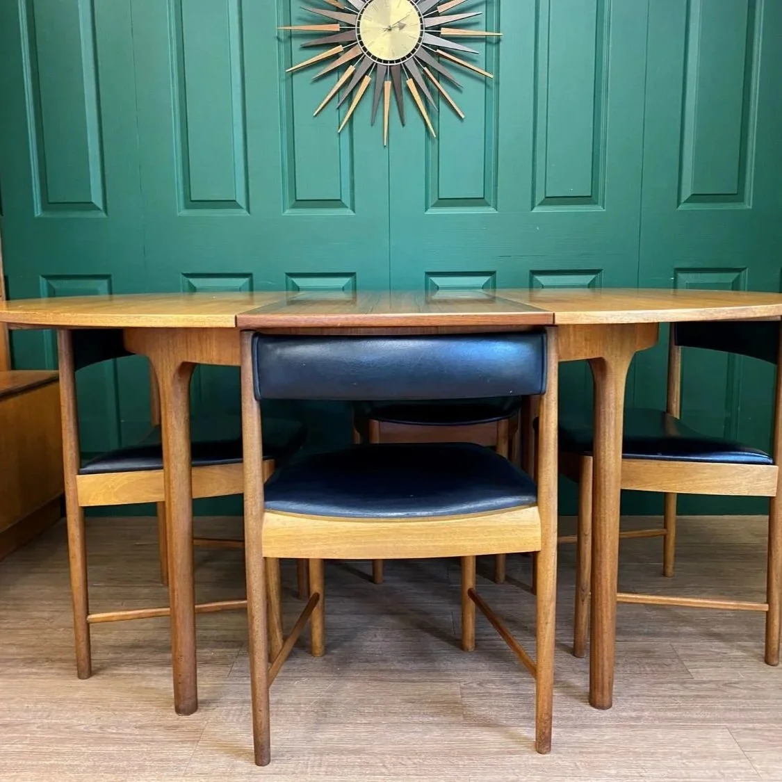 Restored Iconic 1960s McIntosh Circular Teak Extending Dining Table And Four Tuck Under Black Vinyl chairs