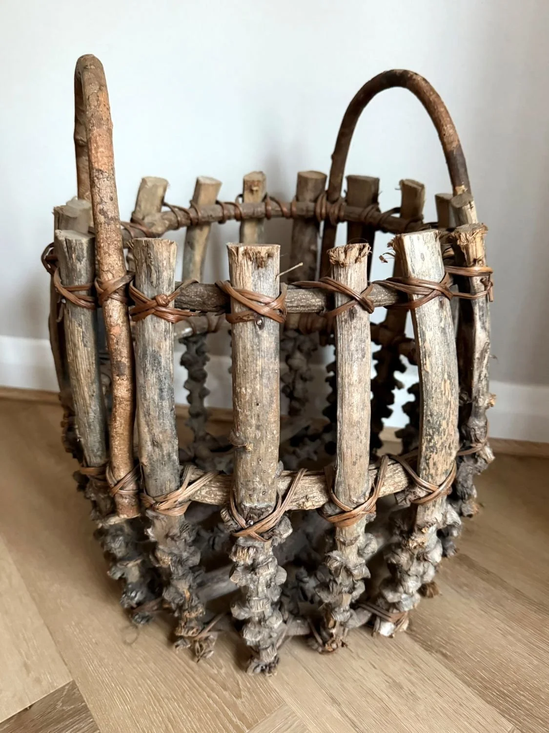 Rustic handmade Adirondack-style twig fire log bucket basket