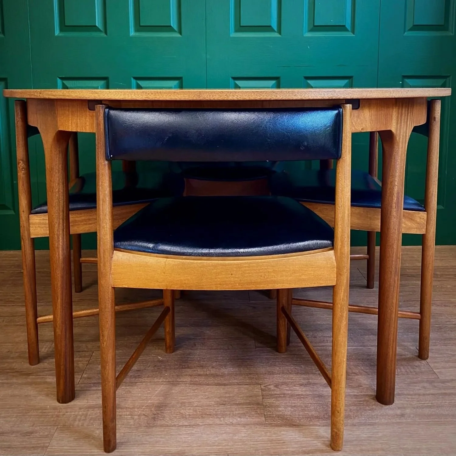 Restored Iconic 1960s McIntosh Circular Teak Extending Dining Table And Four Tuck Under Black Vinyl chairs