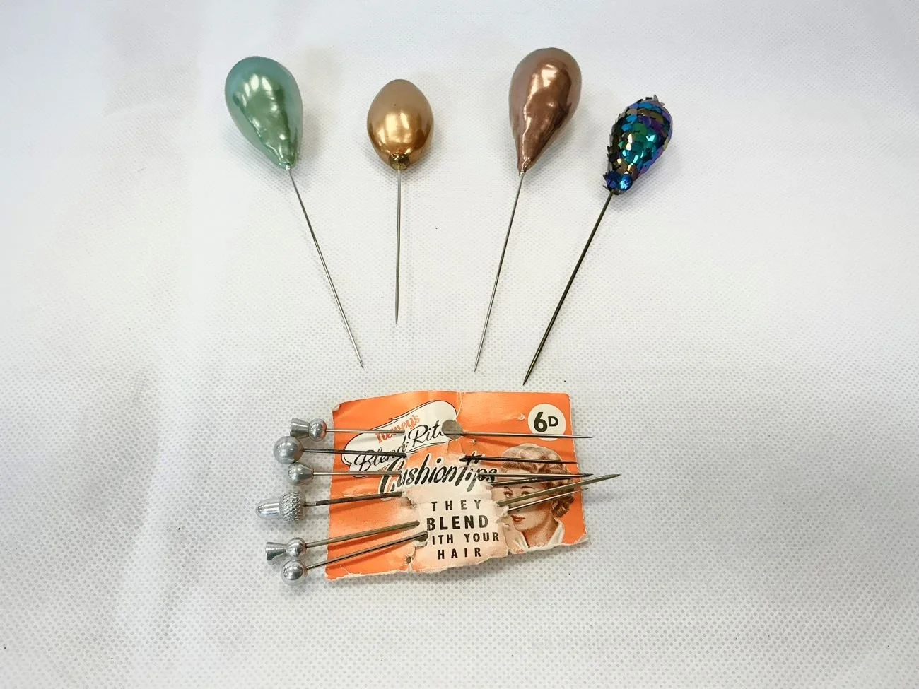 Assorted antique 1920s hat pins.jpg
