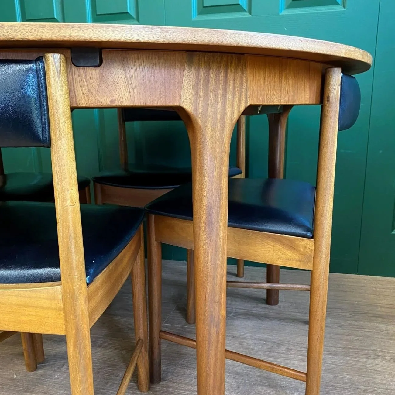 Restored Iconic 1960s McIntosh Circular Teak Extending Dining Table And Four Tuck Under Black Vinyl chairs