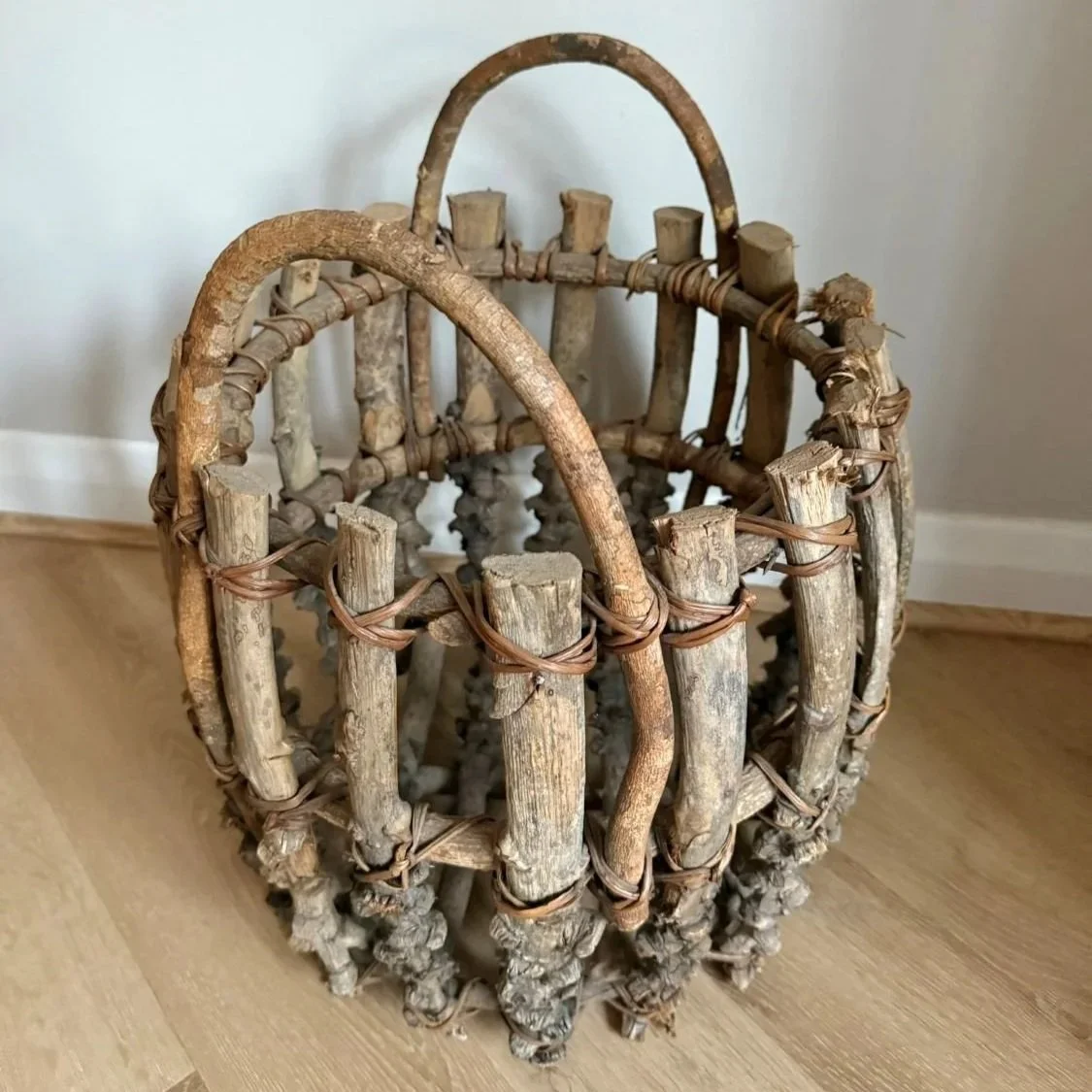 Rustic handmade Adirondack-style twig fire log bucket basket