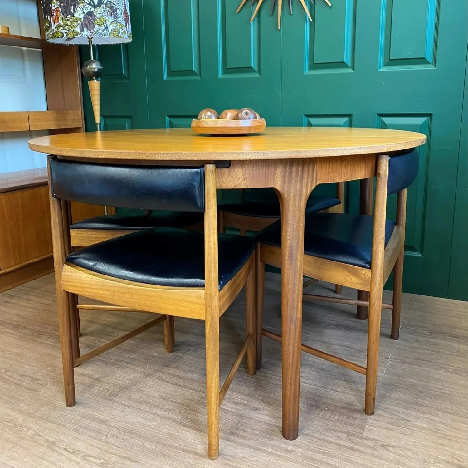 Restored Iconic 1960s McIntosh Circular Teak Extending Dining Table And Four Tuck Under Black Vinyl chairs