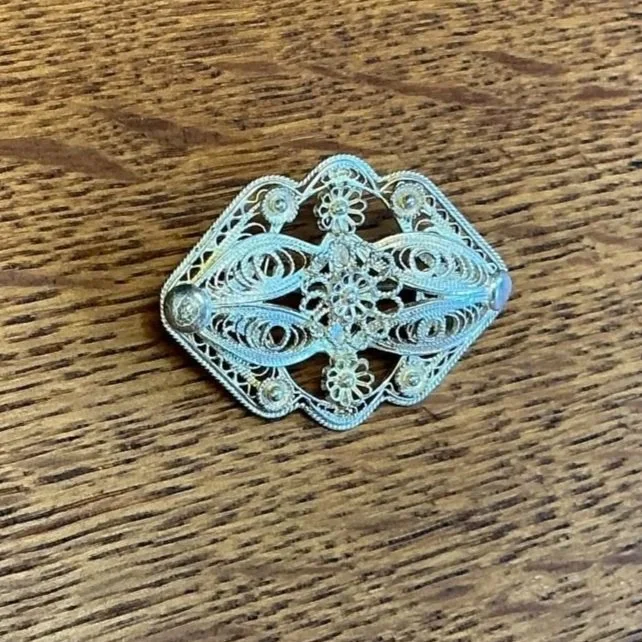Antique silver filigree brooch