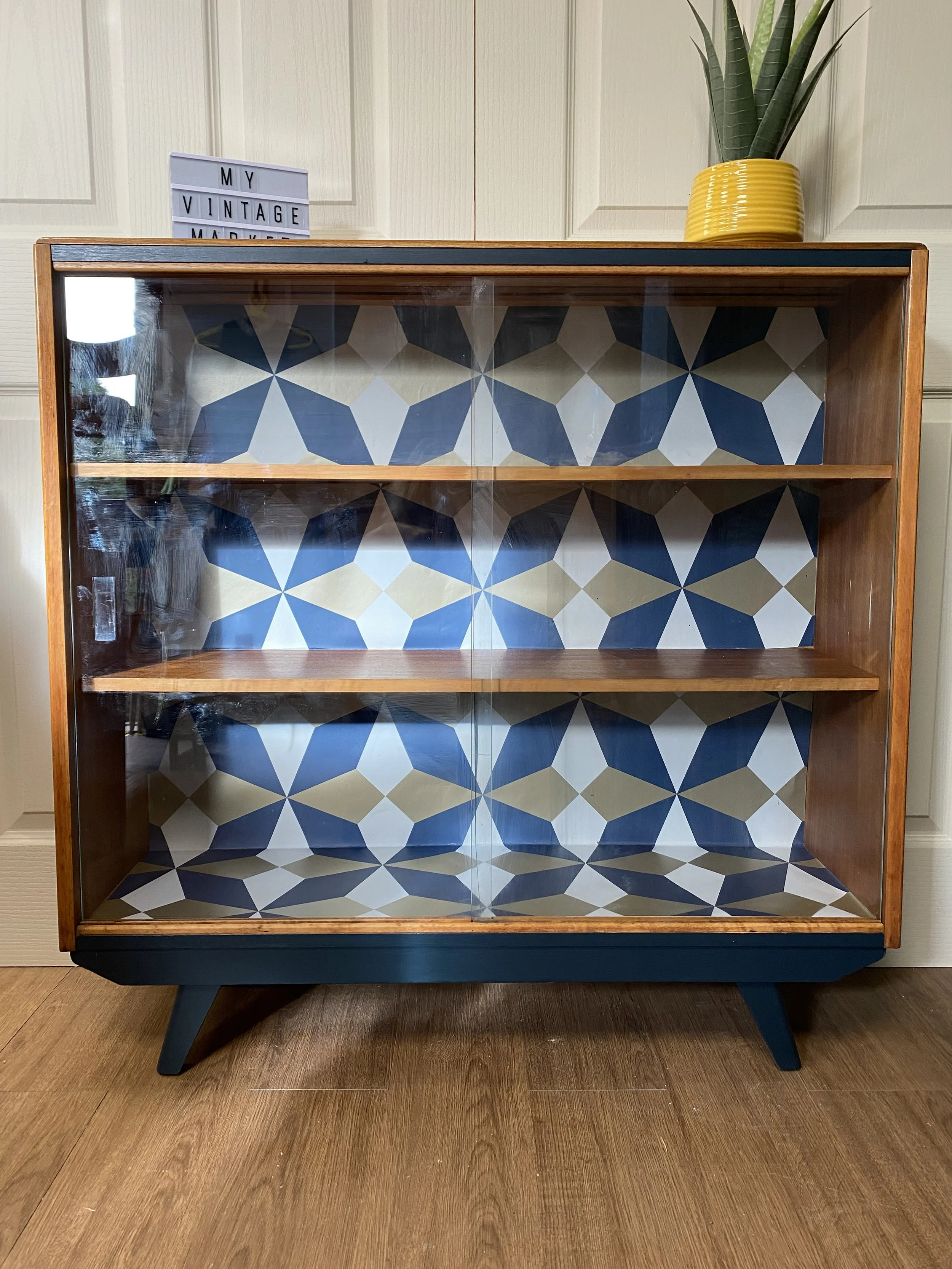 Refurbished mid century slanting teak glazed sliding door bookcase by Avalon Yatton