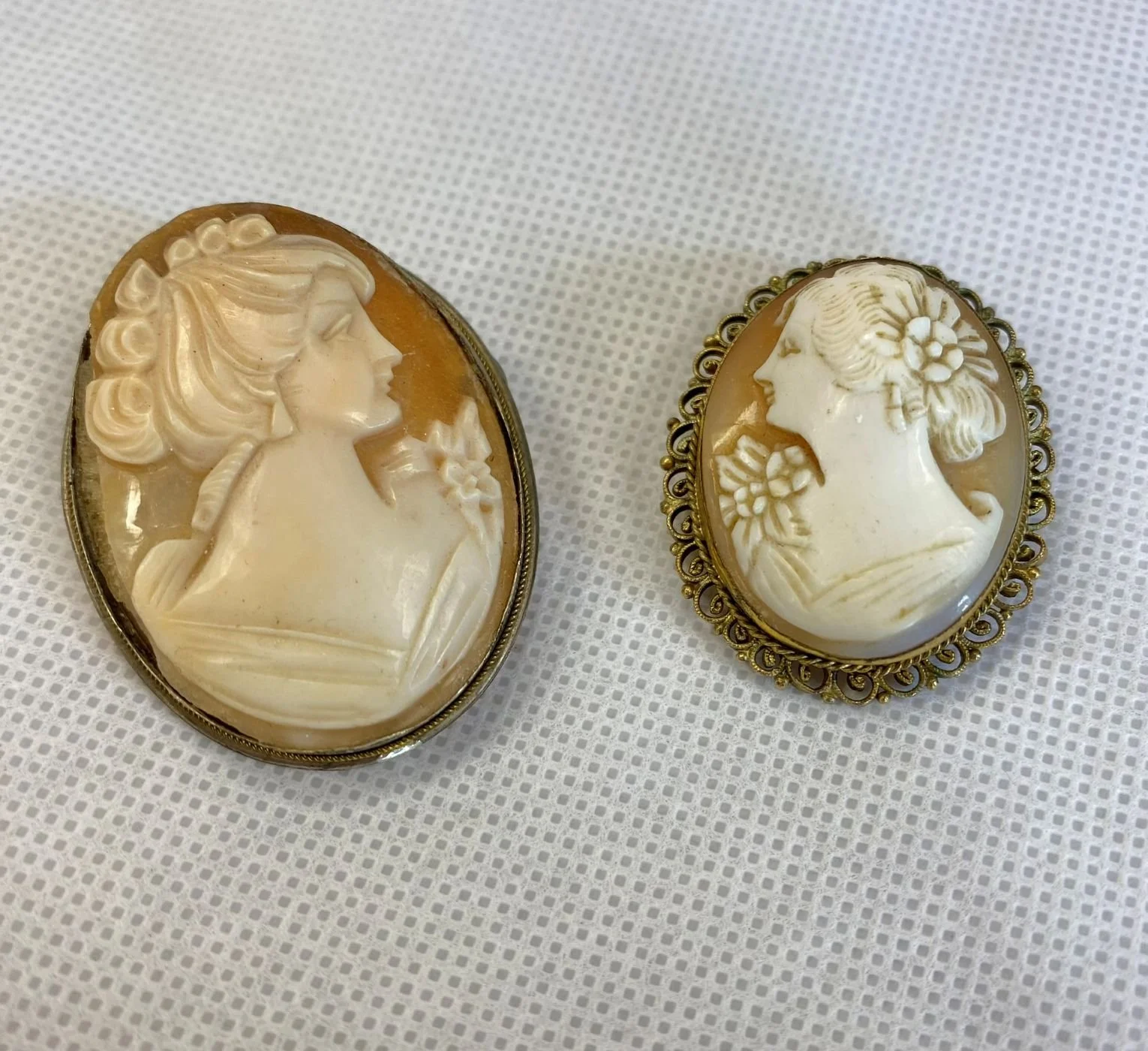 Pair of antique Camelot brooches 