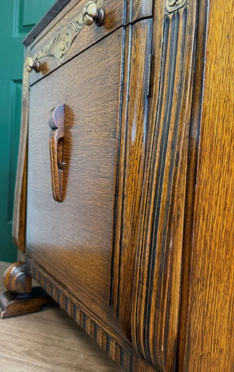 Vintage Art Deco 1930s carved bureau cabinet with sloped design and gold detail
