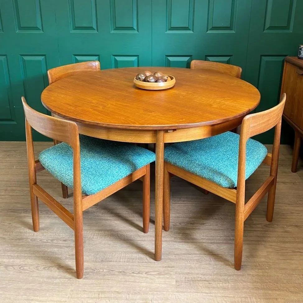 Restored and reupholstered 1960s John Herbert for Younger teak extending circular dining table and four chairs blue