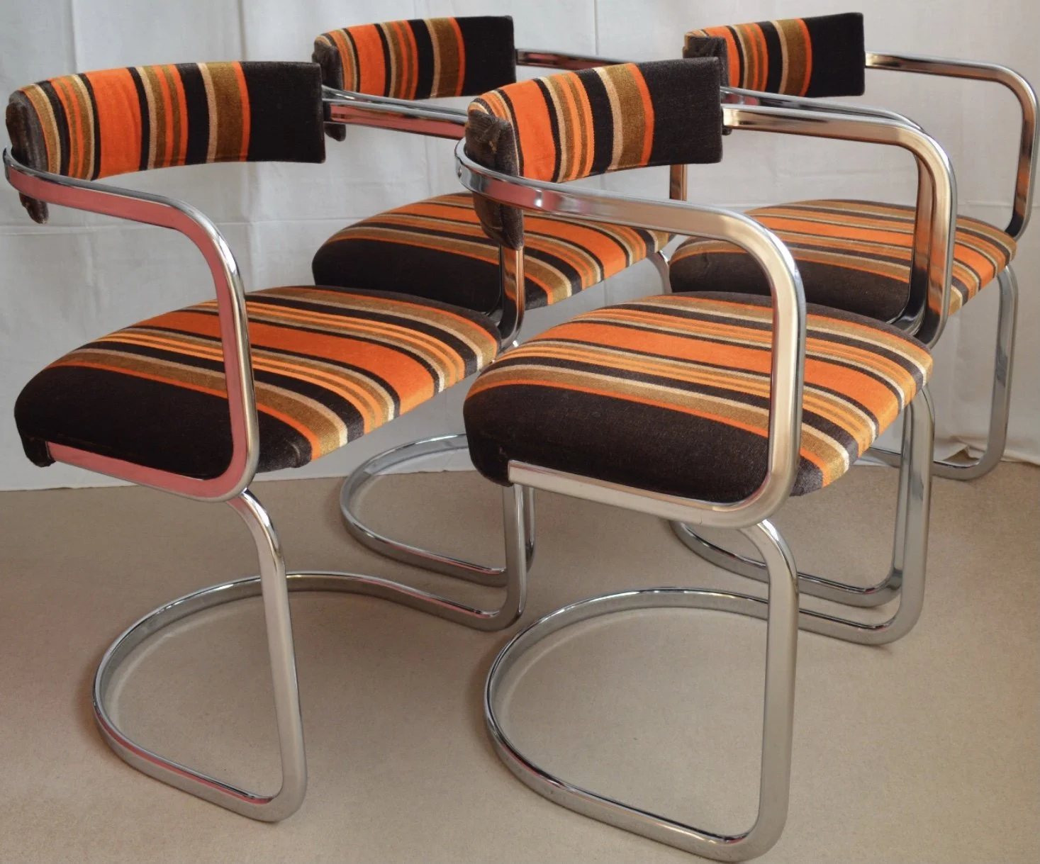 Four vintage 1960s/70s cantilever chairs, orange/brown upholstery