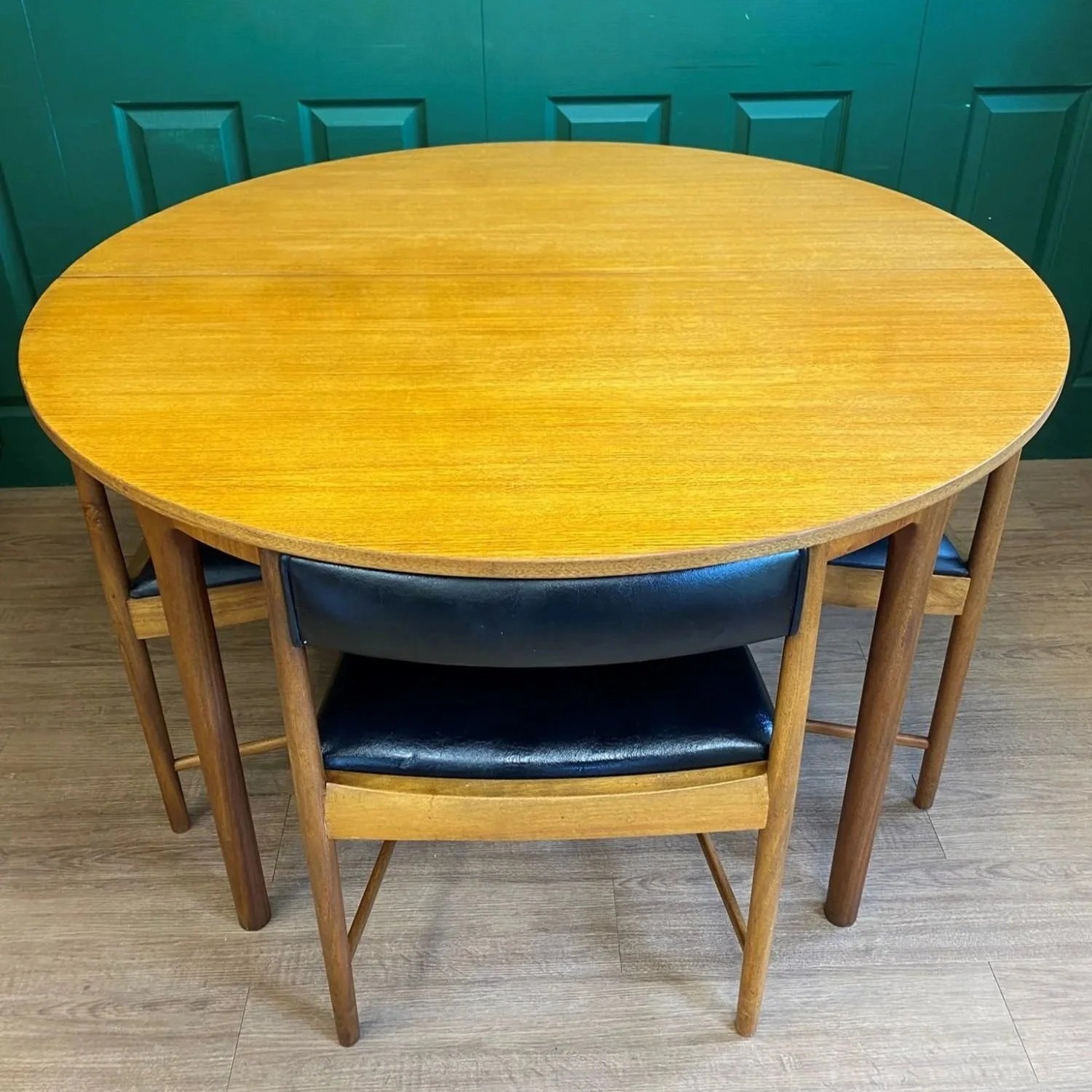 Restored Iconic 1960s McIntosh Circular Teak Extending Dining Table And Four Tuck Under Black Vinyl chairs