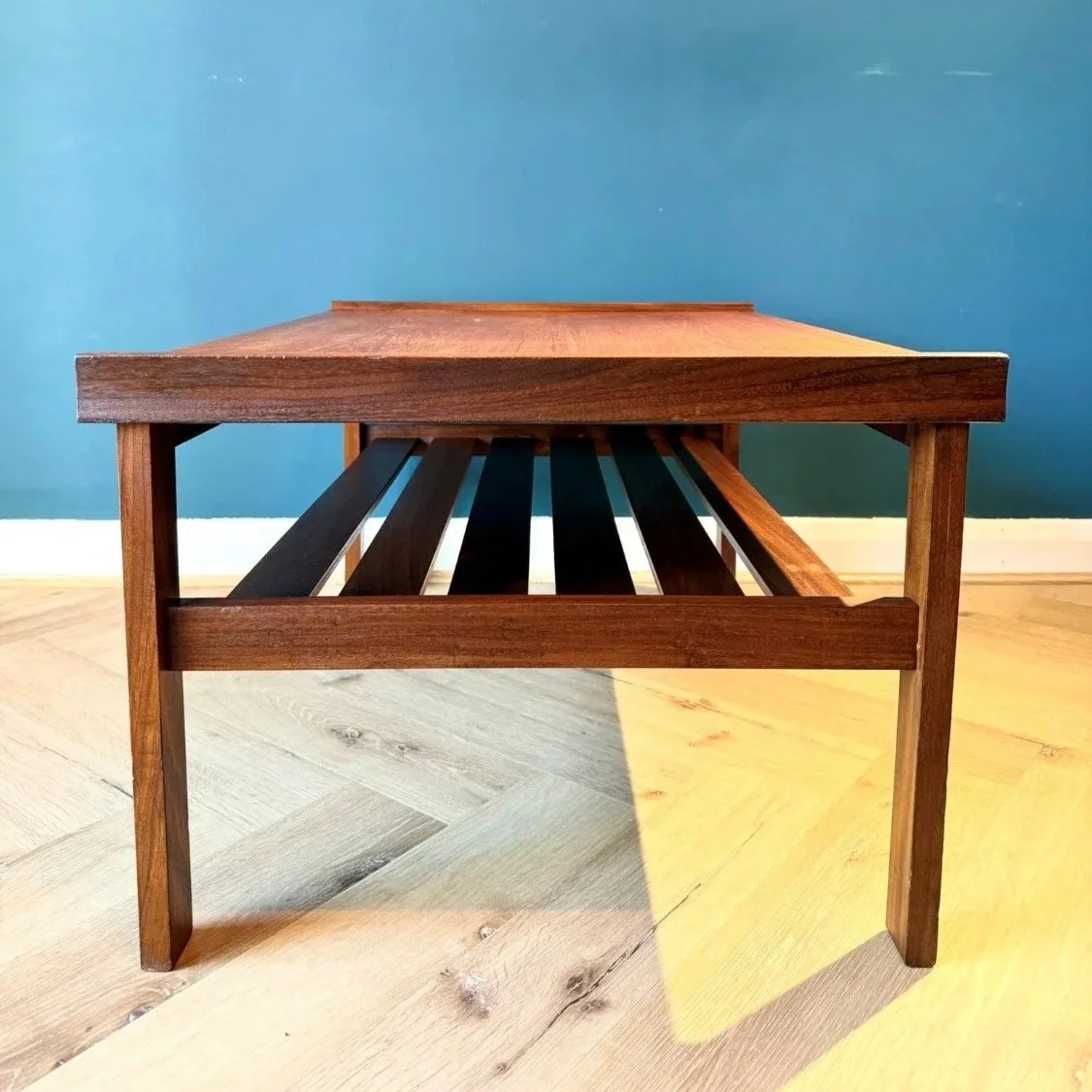 Vintage mid century 1960s two tier teak coffee table with slatted magazine rack