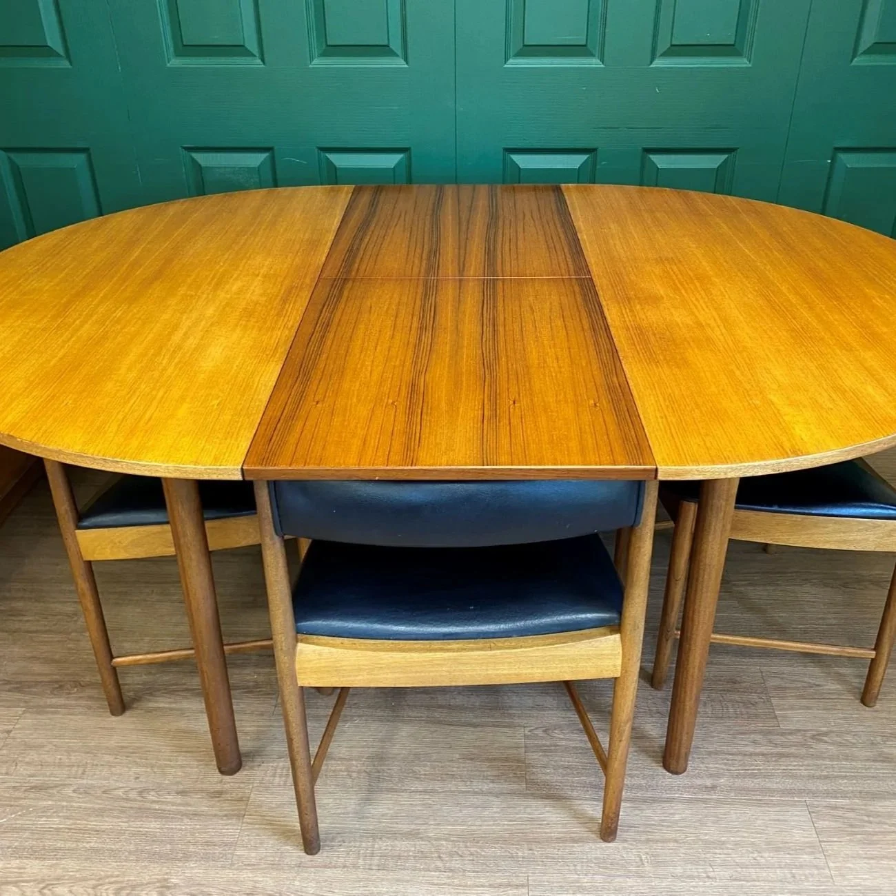 Restored Iconic 1960s McIntosh Circular Teak Extending Dining Table And Four Tuck Under Black Vinyl chairs