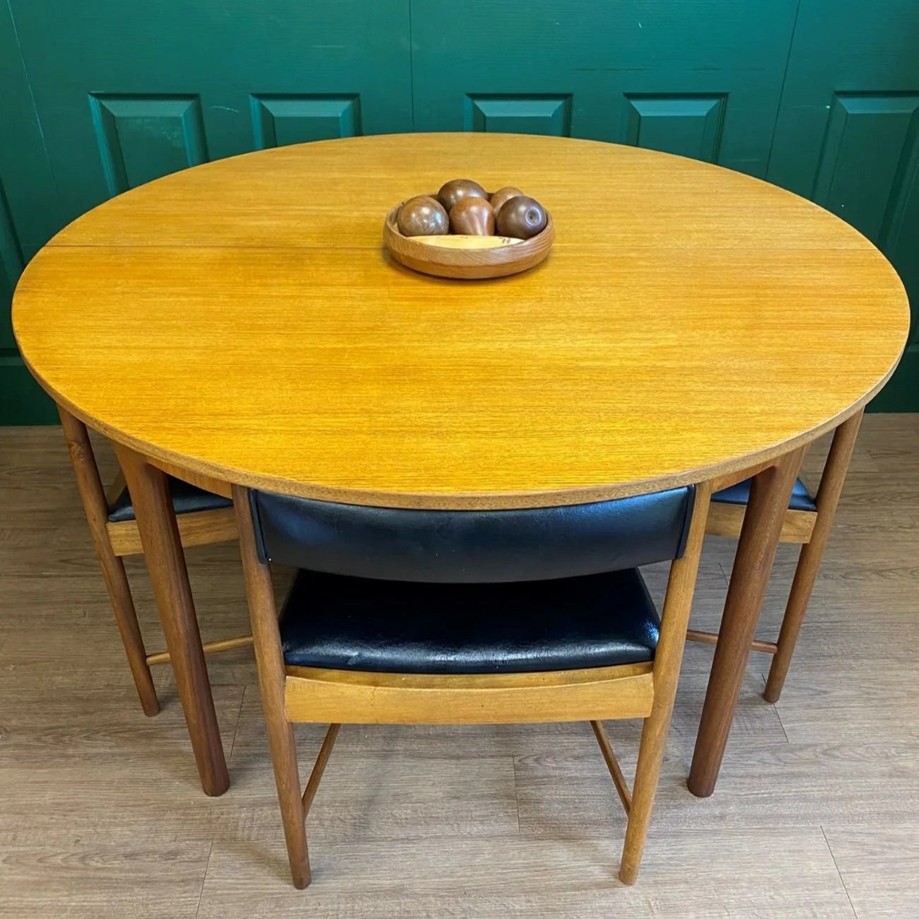Restored Iconic 1960s McIntosh Circular Teak Extending Dining Table And Four Tuck Under Black Vinyl chairs