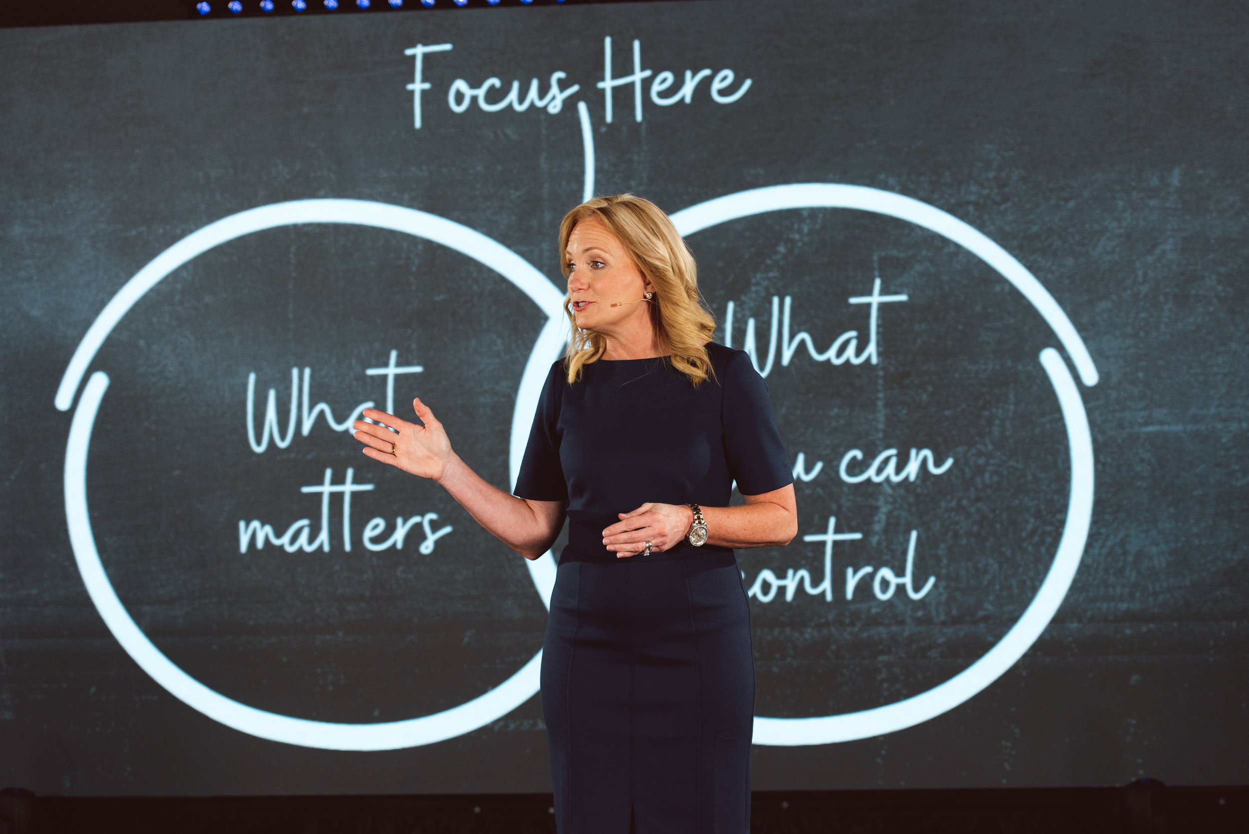 Dr. Julie Hasson giving keynote on stage
