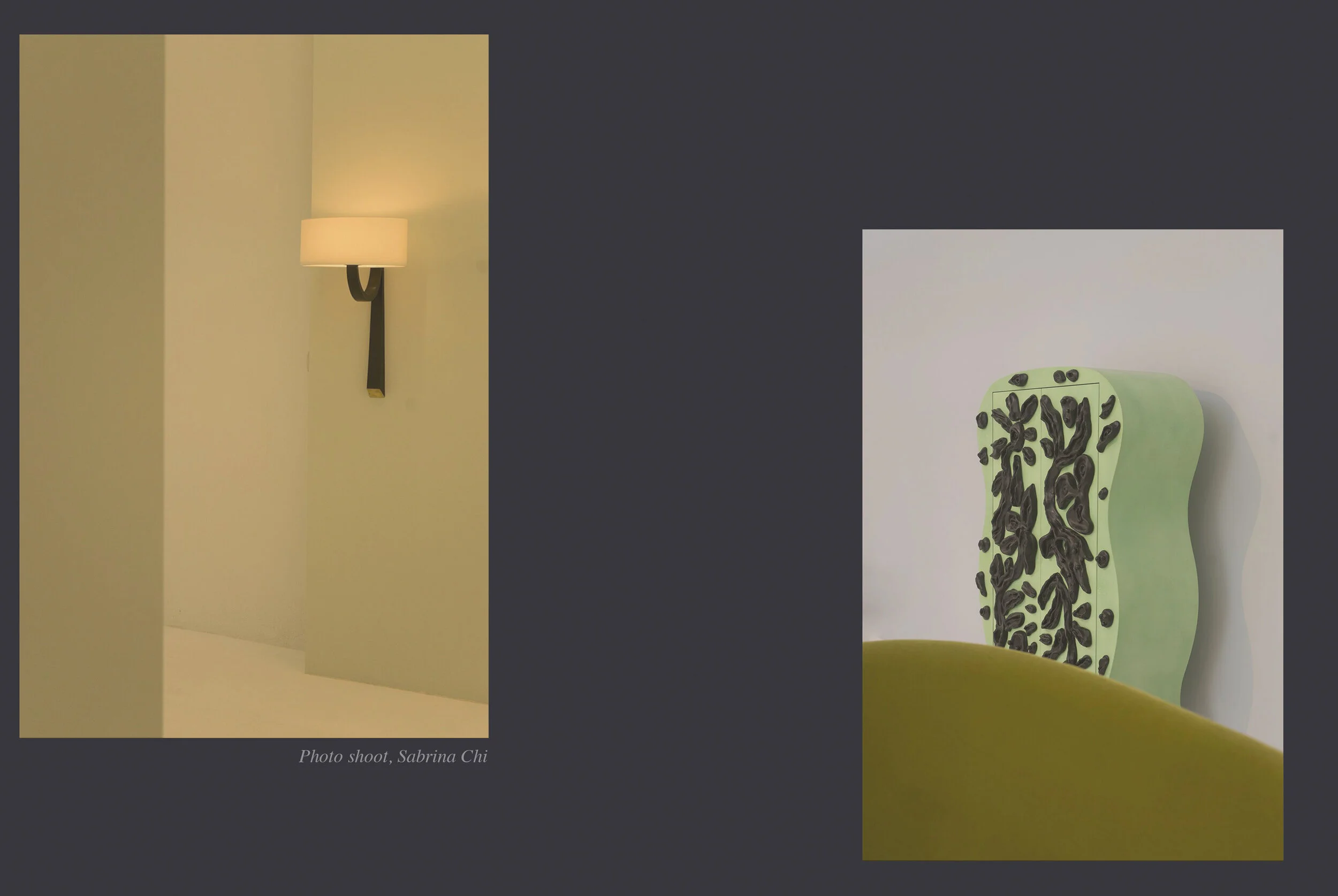A wall-mounted beige lamp on a black curved arm, illuminating a beige wall. Adjacent to it is a green ceramic sculpture with black abstract designs, placed on top of a yellow surface.