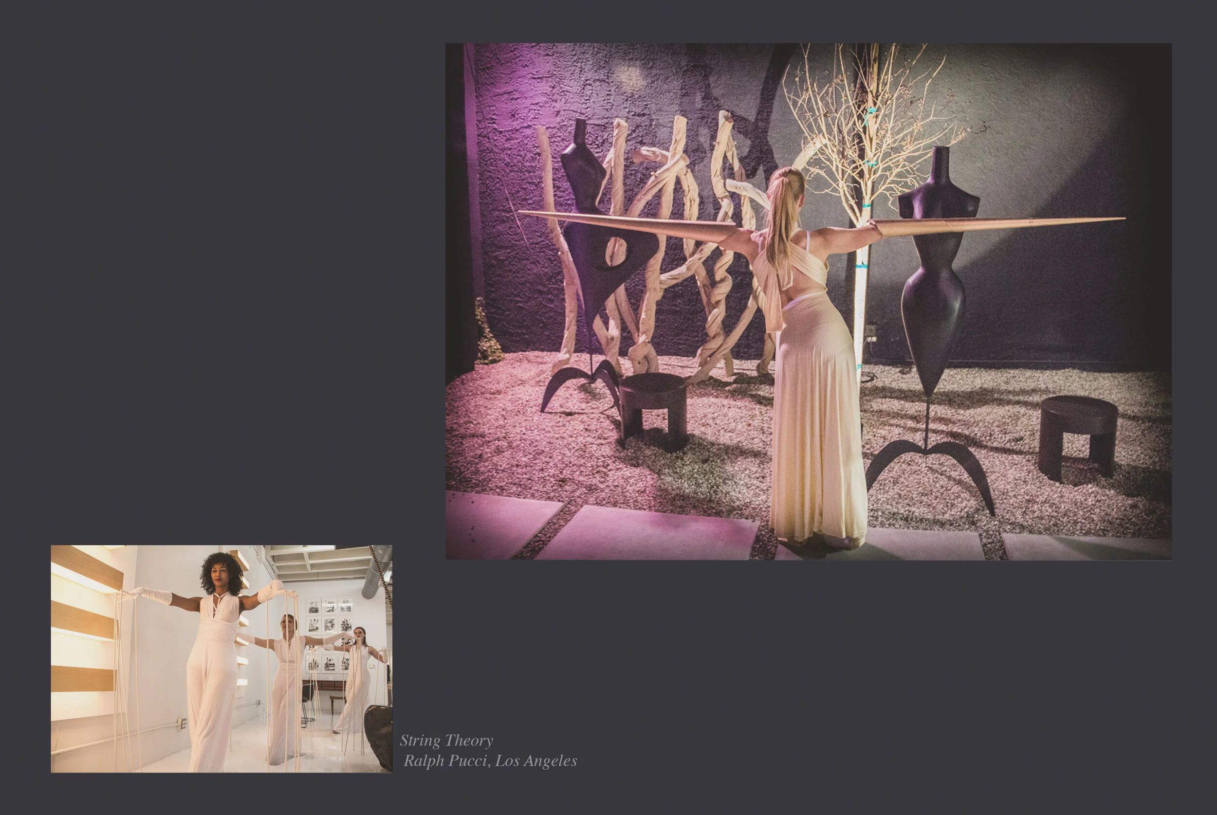 An art installation featuring a woman in a long, flowing dress with arms extended, standing in an indoor gallery. The background includes abstract sculptures made of twisted wood, a leafless tree, and a purple-hued wall.