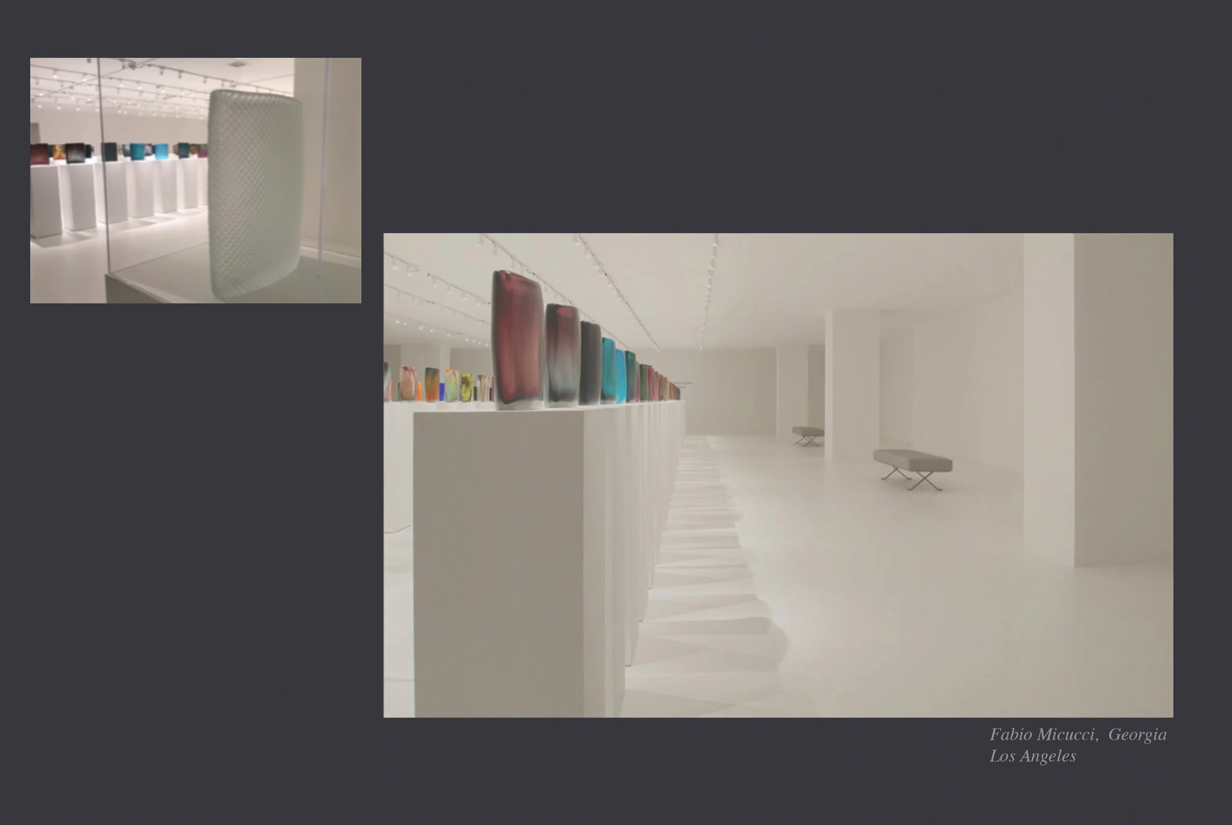 A modern art gallery with white walls and a sleek white floor. Artworks include colorful glass sculptures displayed on white pedestals, with some taller glass pieces on a ledge. The gallery is well-lit with track lighting. The photo appears to be a d