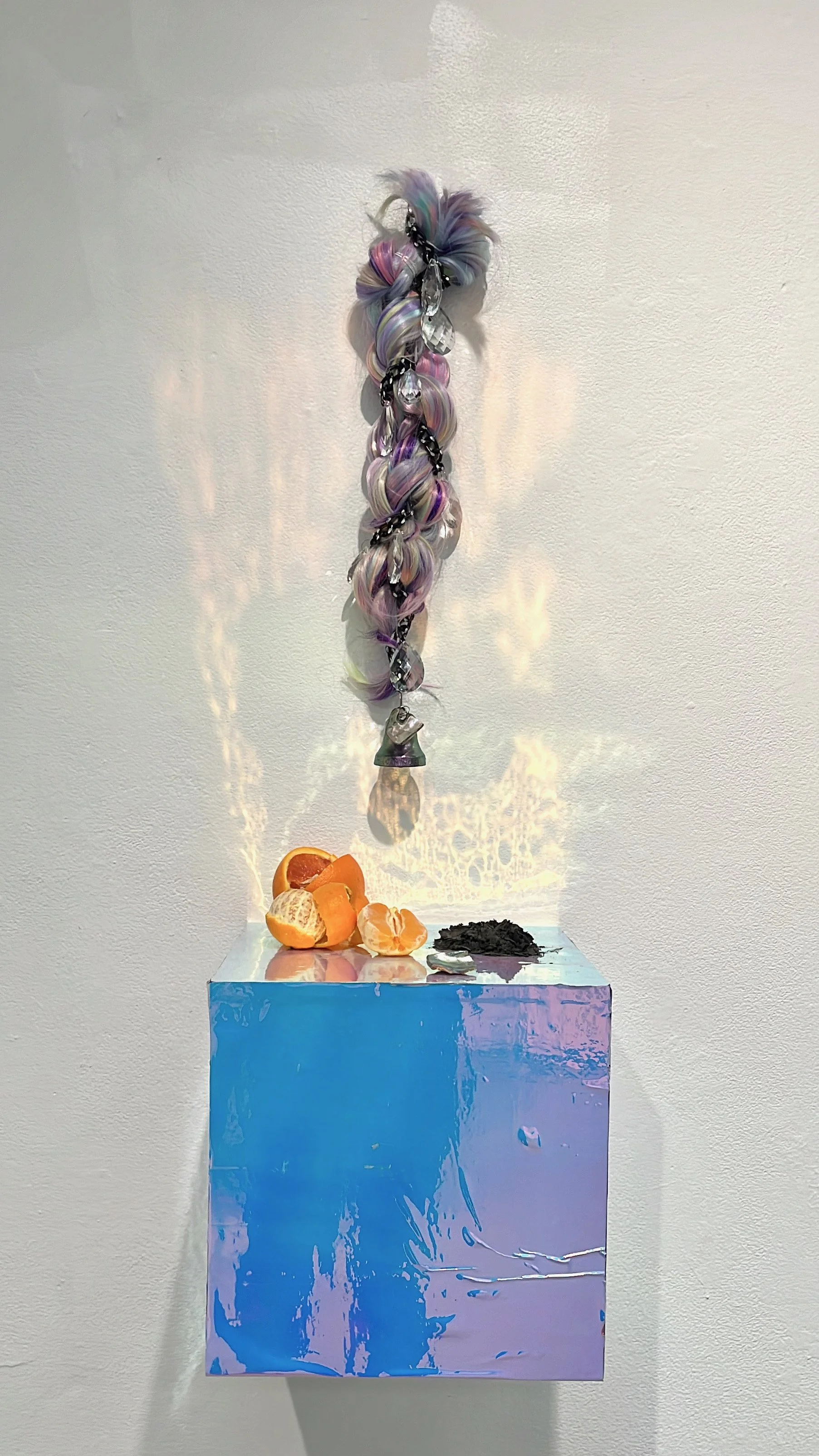 Lovesick Daughter (I hear the mission bells
above)
2023
Dimensions variable
Synthetic hair, acrylic prisms, found metal chain, replica of an El Camino Real bell, iridescent nail polish, ashes of a burned piece of amate paper, found abalone shells, Ca