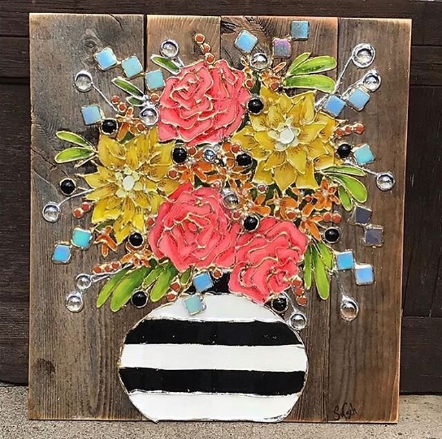 Flower pot on barn wood art by @sharczeh are so bright and beautiful. Come in and check out more of Shar&rsquo;s art and jewelry between 12 and 4 pm.

#fernieart #fernieartscoop #downtownfernie #floralart #flowers #wallart #barnwoodart #art