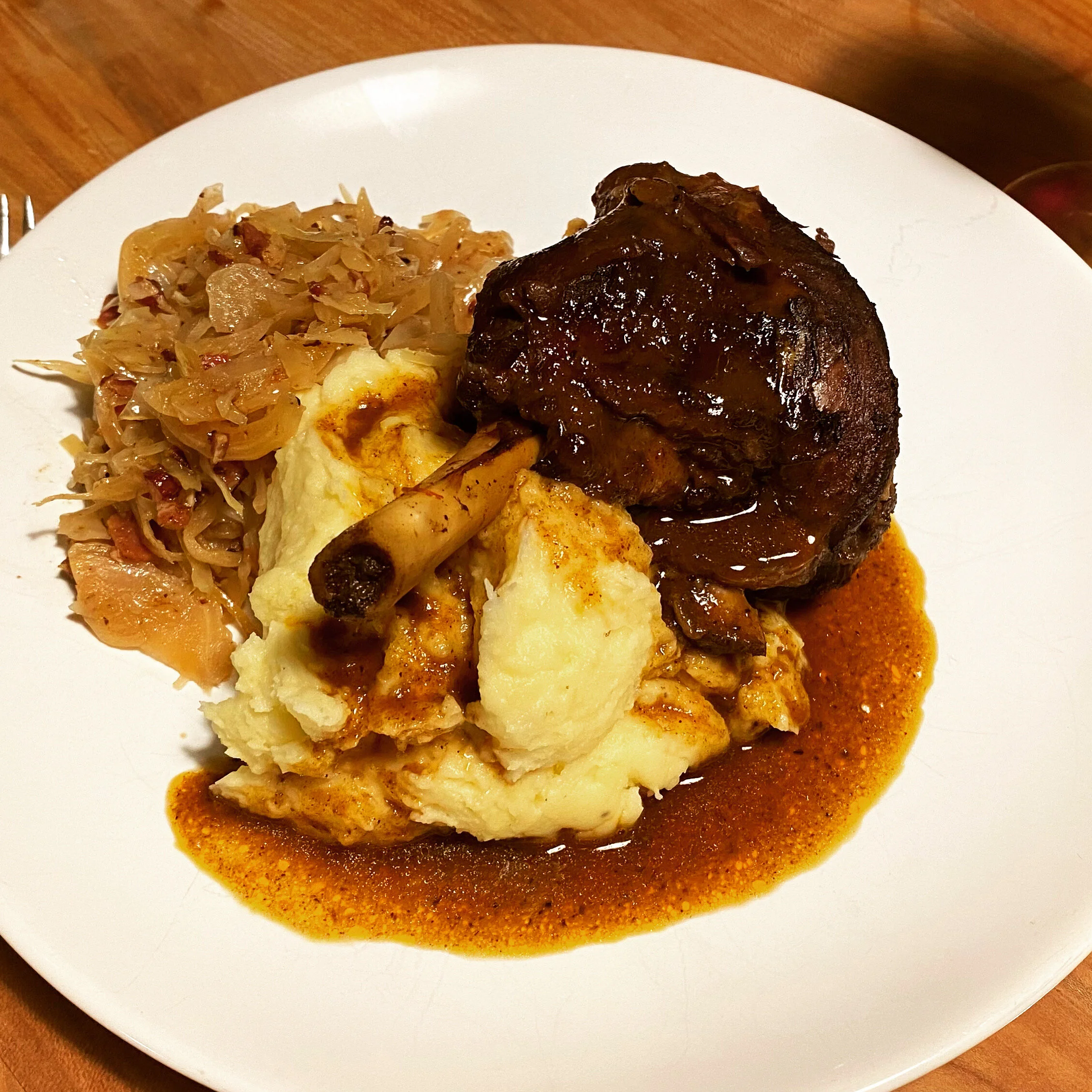 2 Slow-cooked Lamb Shanks  in Red Wine and Chili Sauce  with Mashed Potatoes and Mint Dip