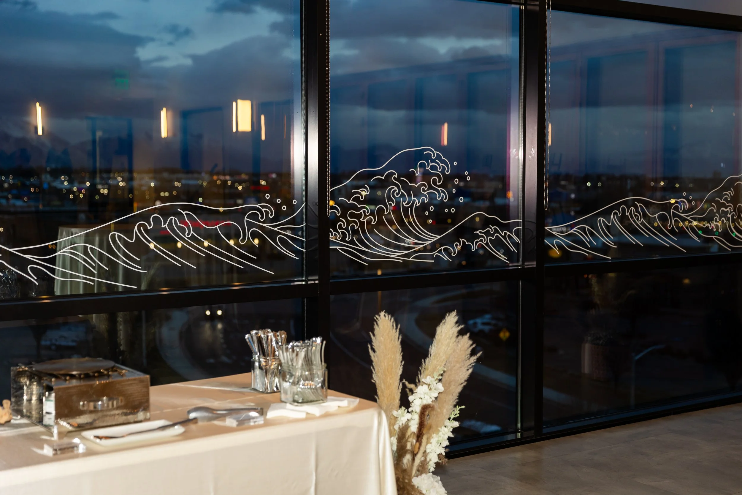 Wave illustration on the Skylight Room window.