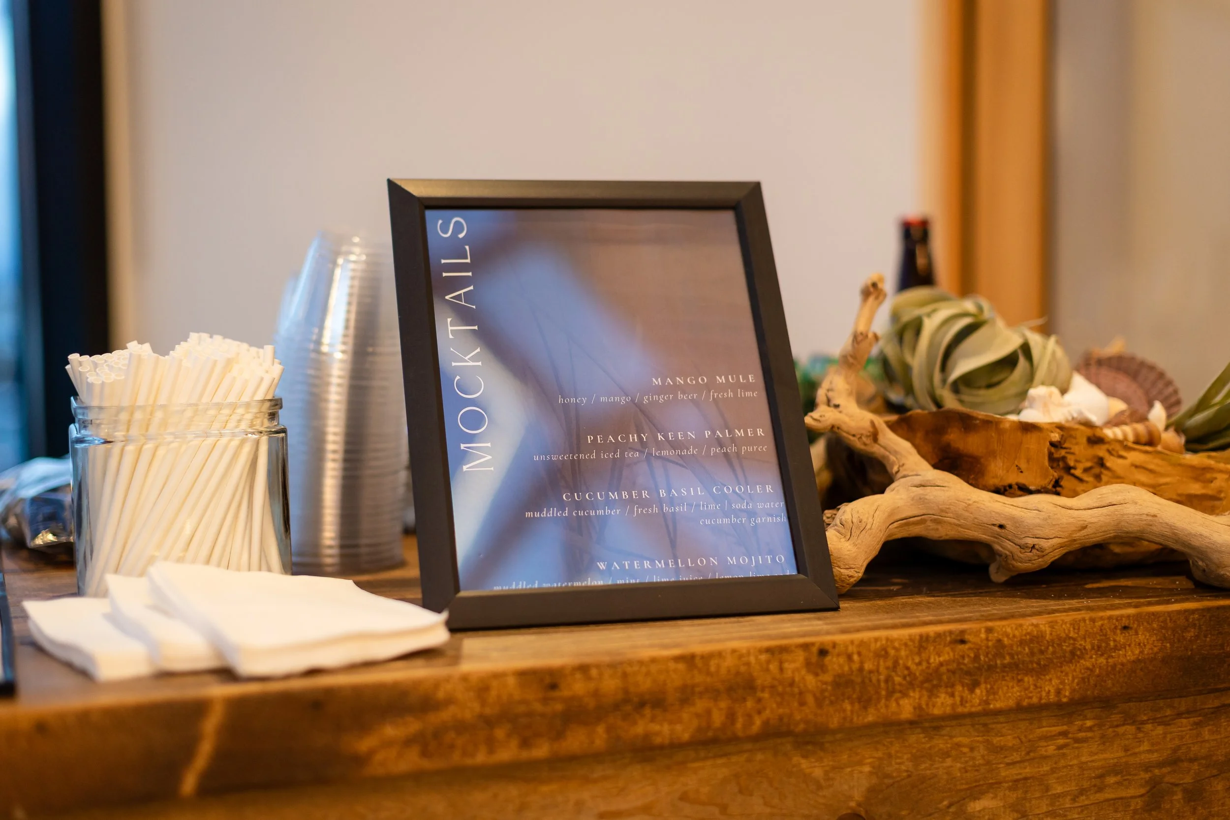 Mocktail menu on wooden table.