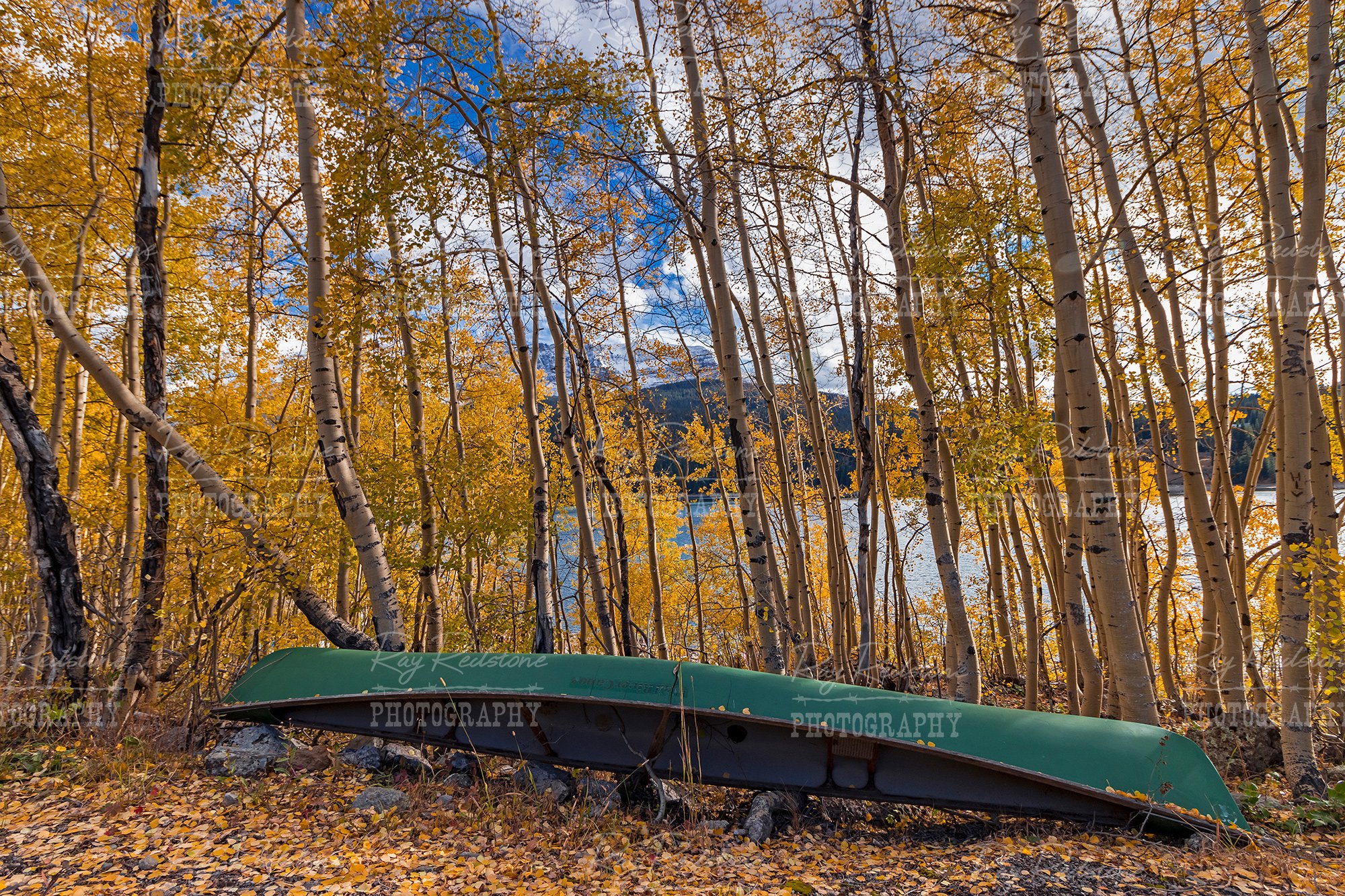 Canoes By Colorado Lake At Fall Time