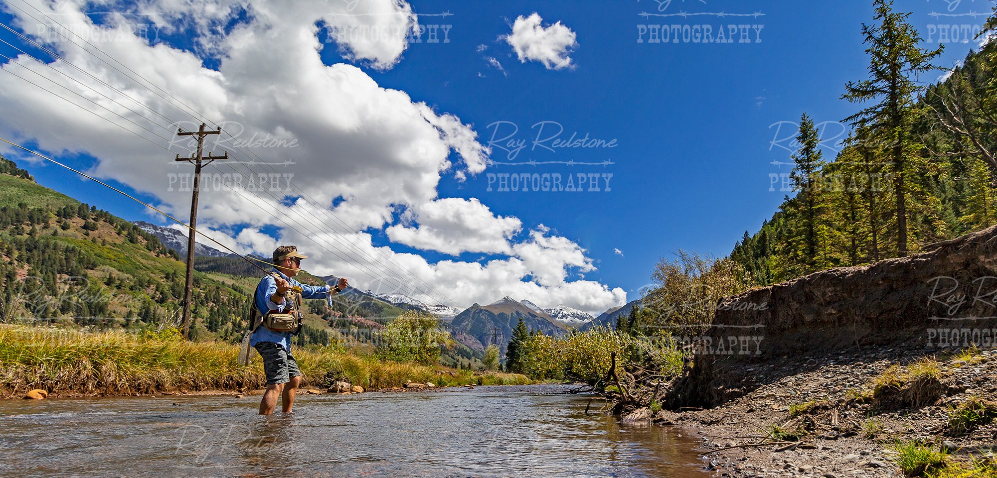 Man Fly Fishing on San Miguel River Near Telluride CO