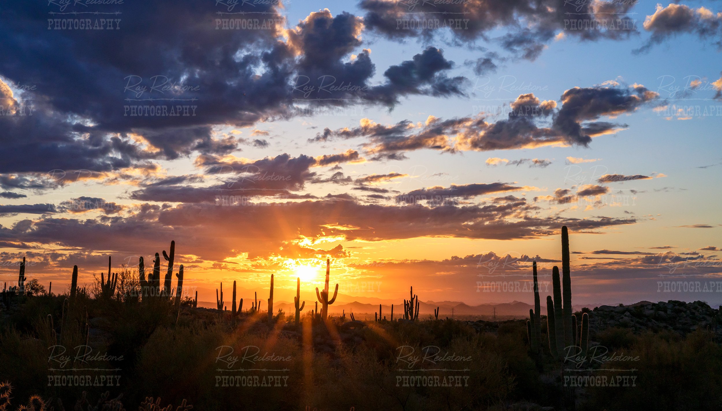 Panoramic View Of Setting Sun With Sunrays