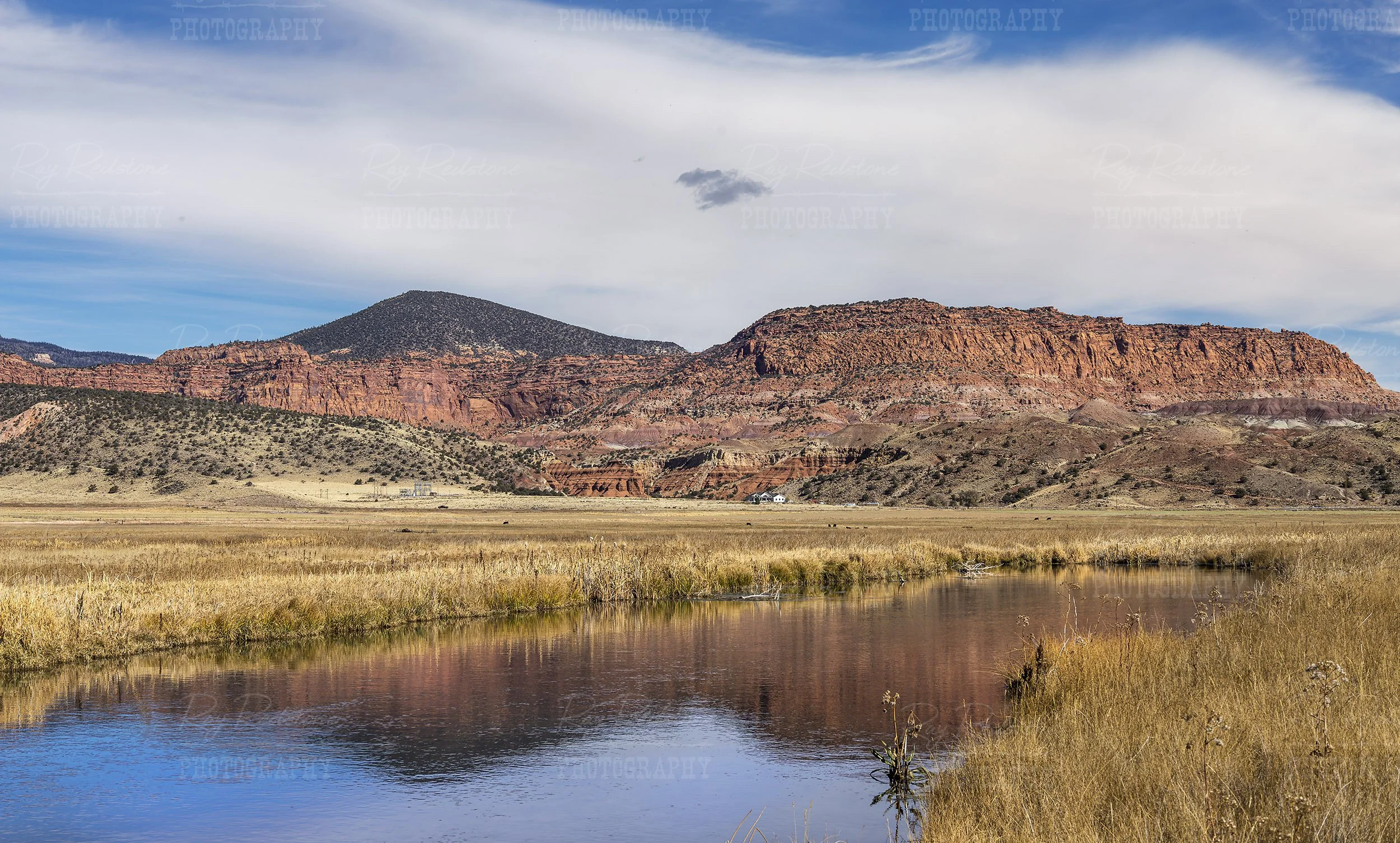 Reflection On Fremont River Near Torrey Utah