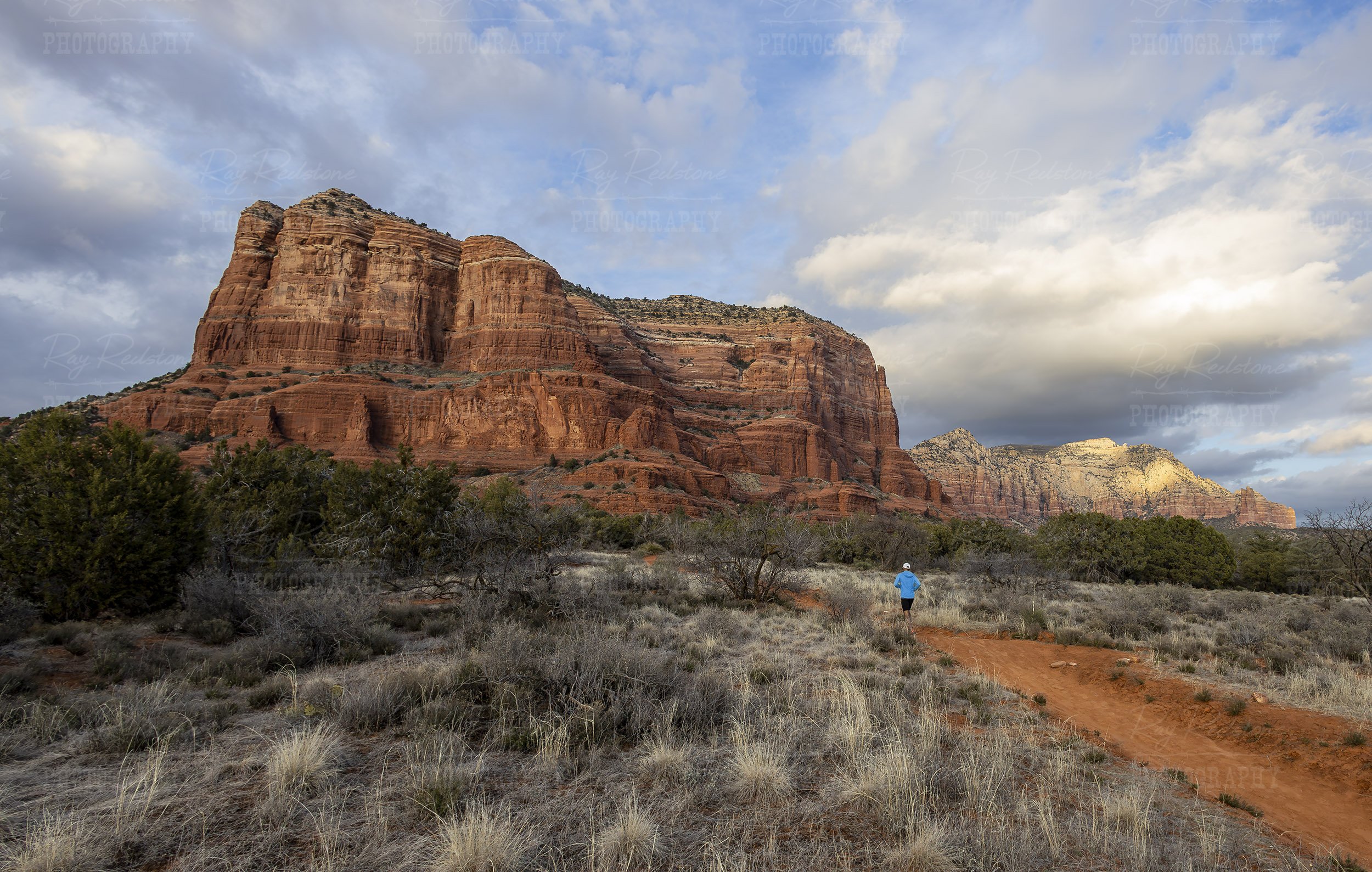 Man Running On Trail Near Courthouse Butte In Sedona AZ