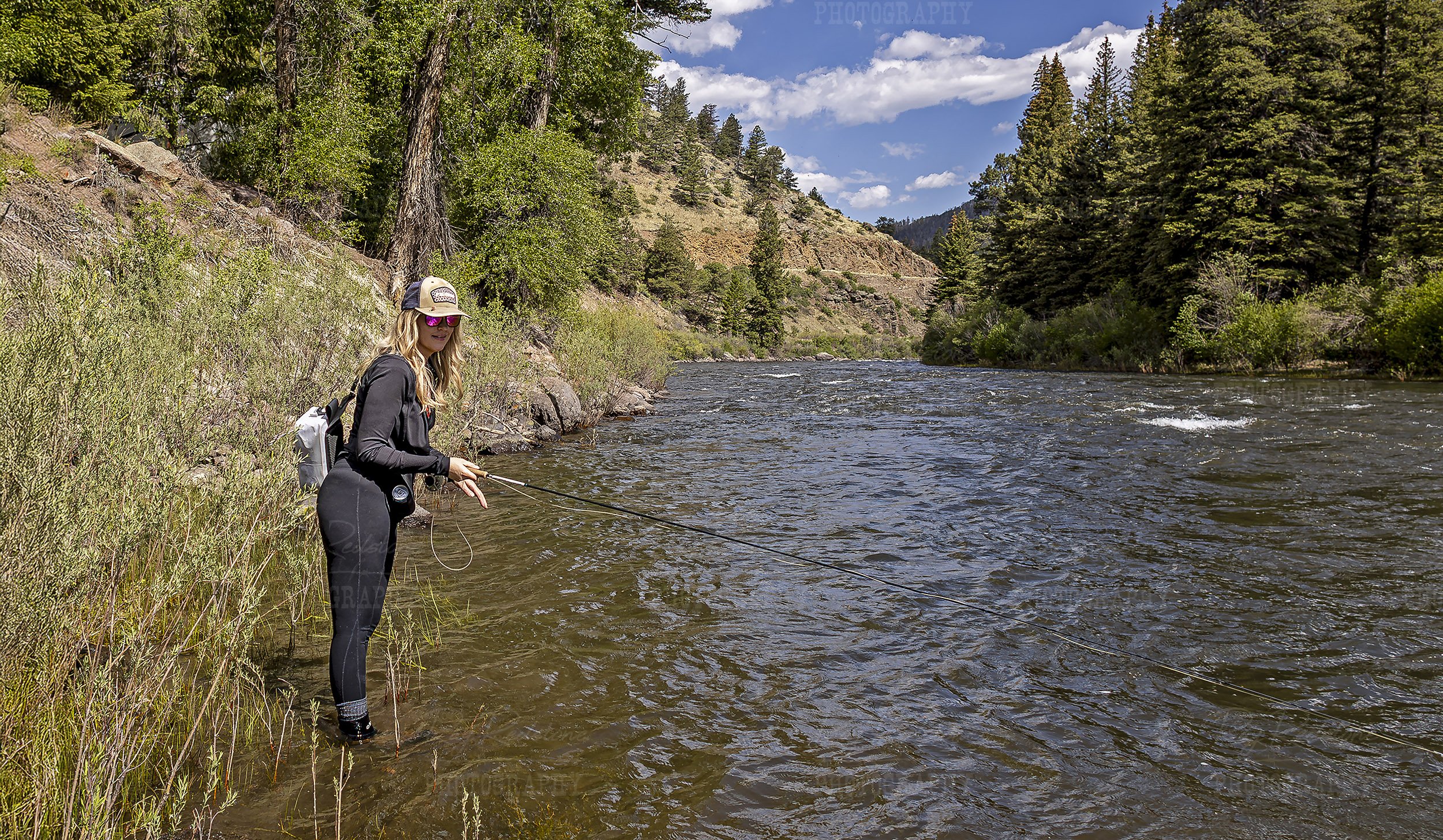 Women Fly Fishing On The Rio Grande River In Colorado