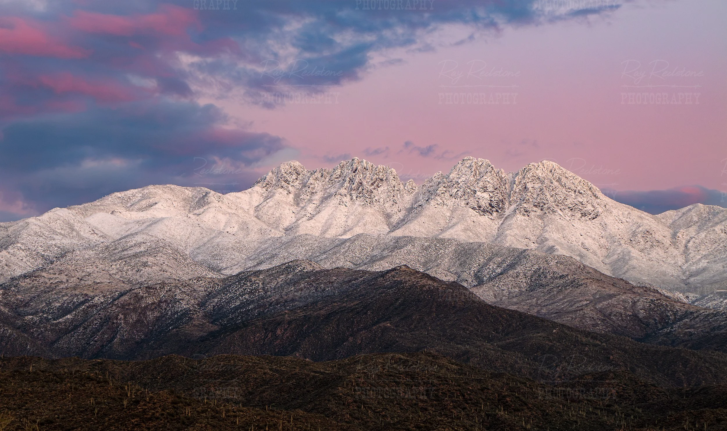 Snow Covered Four Peaks At Sunset In Arizona